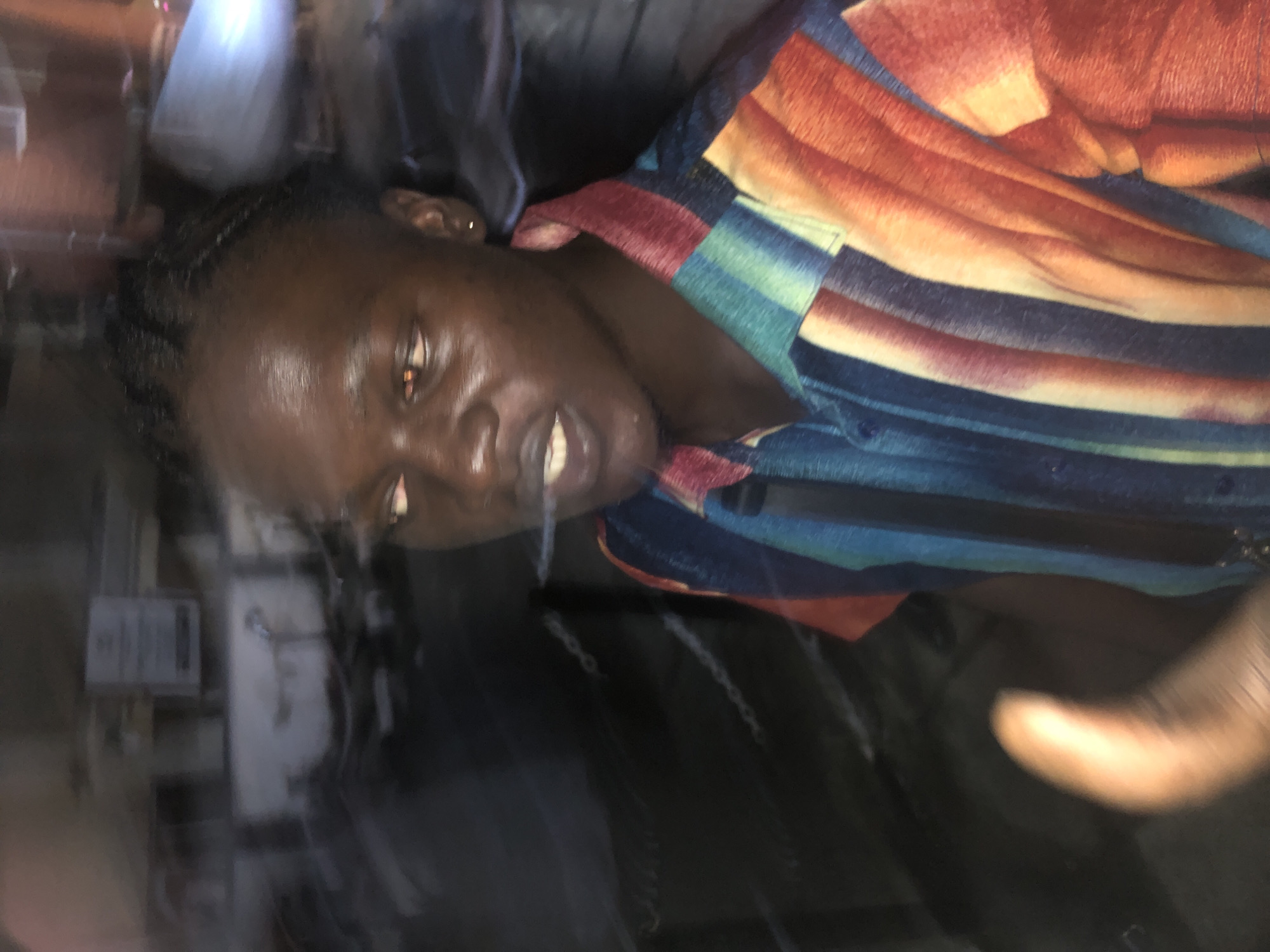 Evening street life documented in Nigerian communities during rainfall