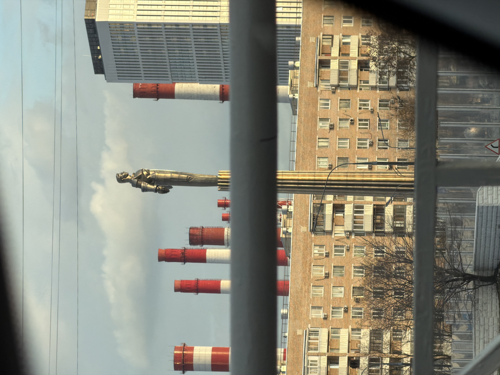 Moscow Space Monument Viewed Through Barred Window