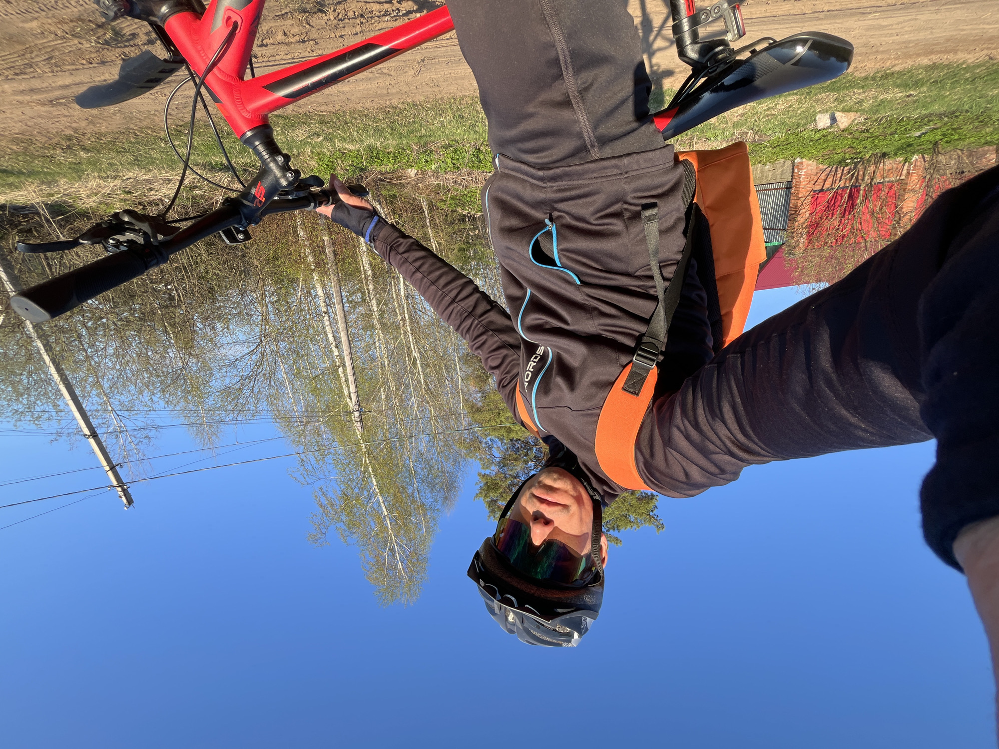 Cyclist takes selfie on dirt road in Chaikovsky