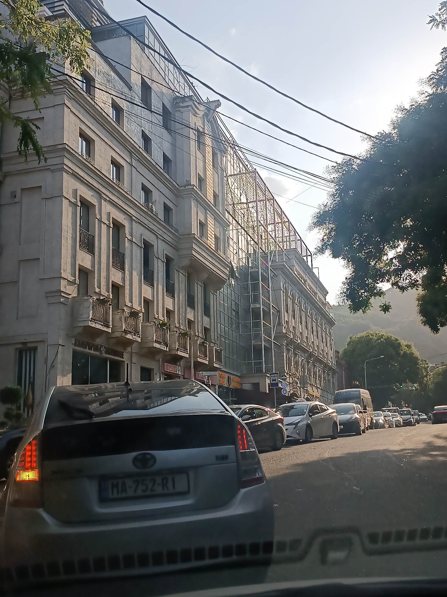 Old brick, iron details, and street life in central Tbilisi
