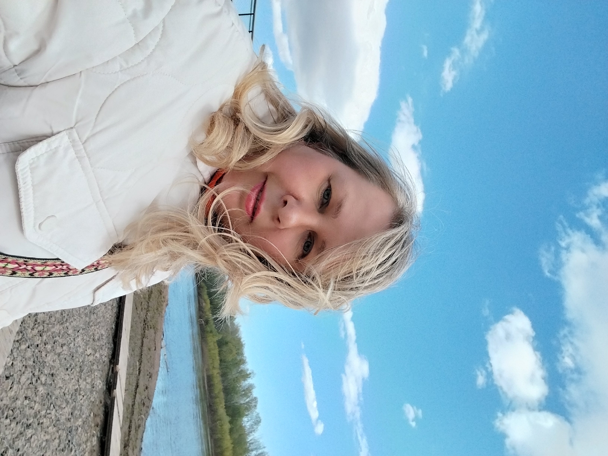 Woman documents riverside outing in Orenburg, Russia with selfies