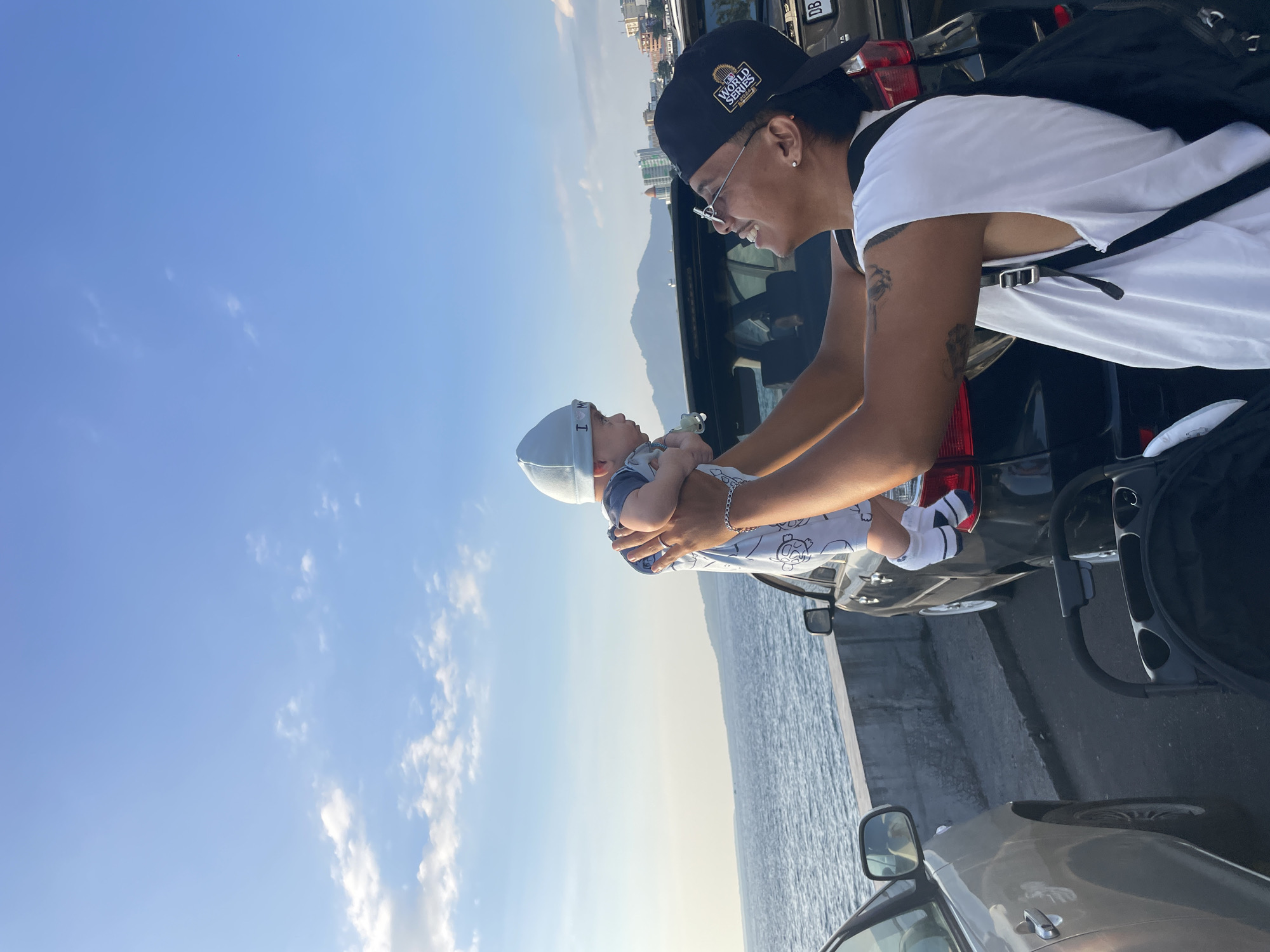 Waterfront stop in Manado with bay views and a baby moment