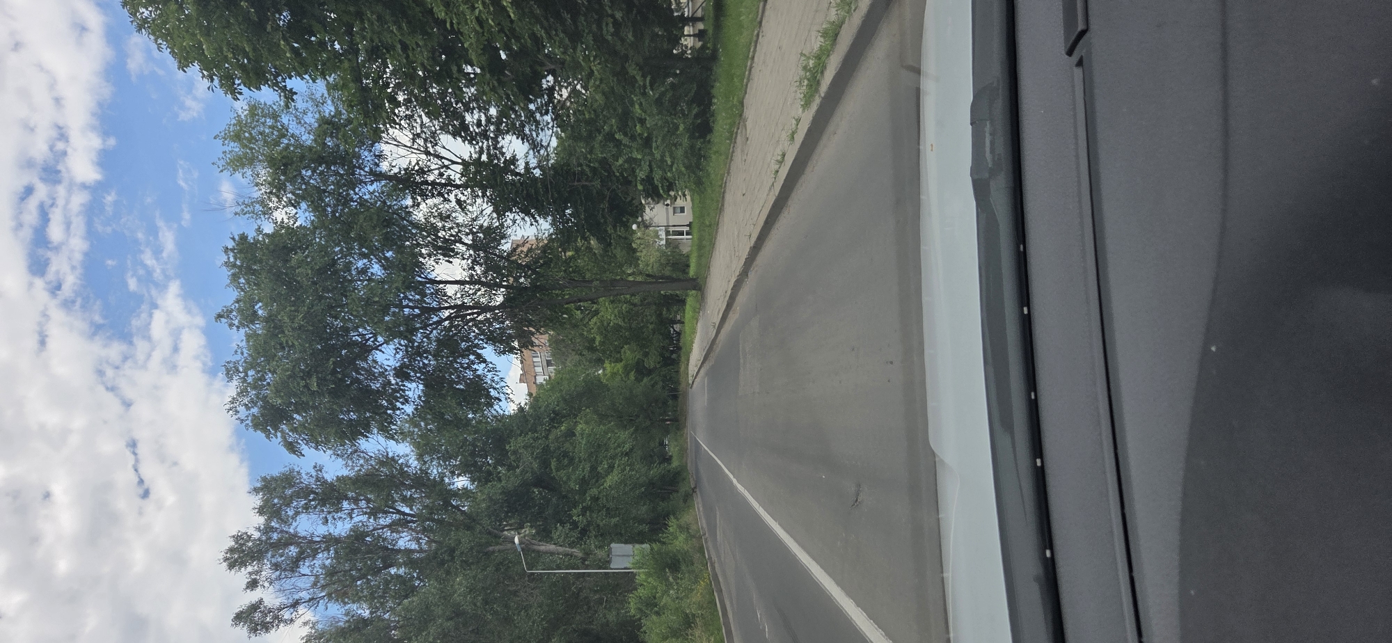 Street-level drive through Donetsk under overcast skies