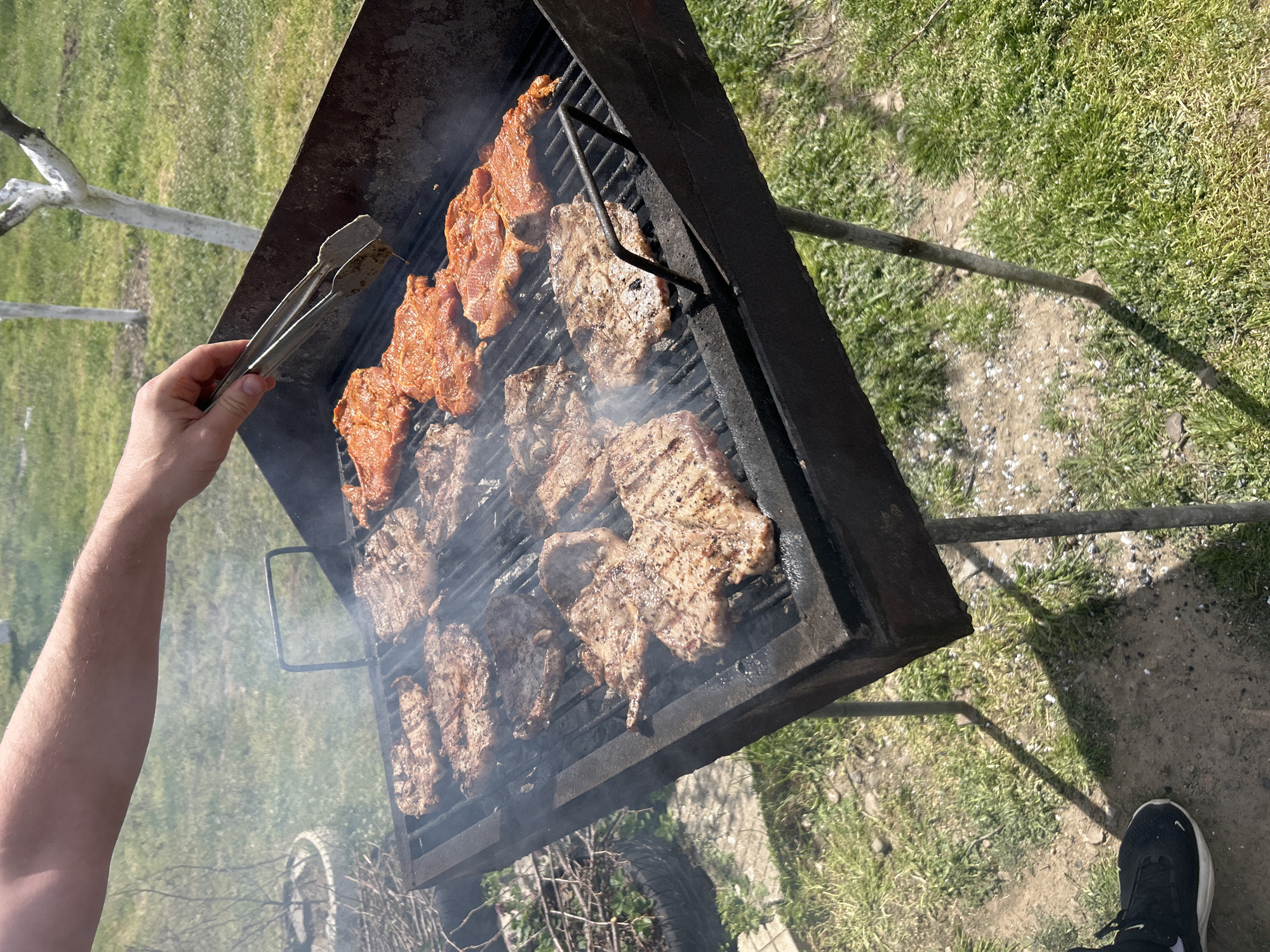 Person grills meat outdoors in Sopot, Bulgaria