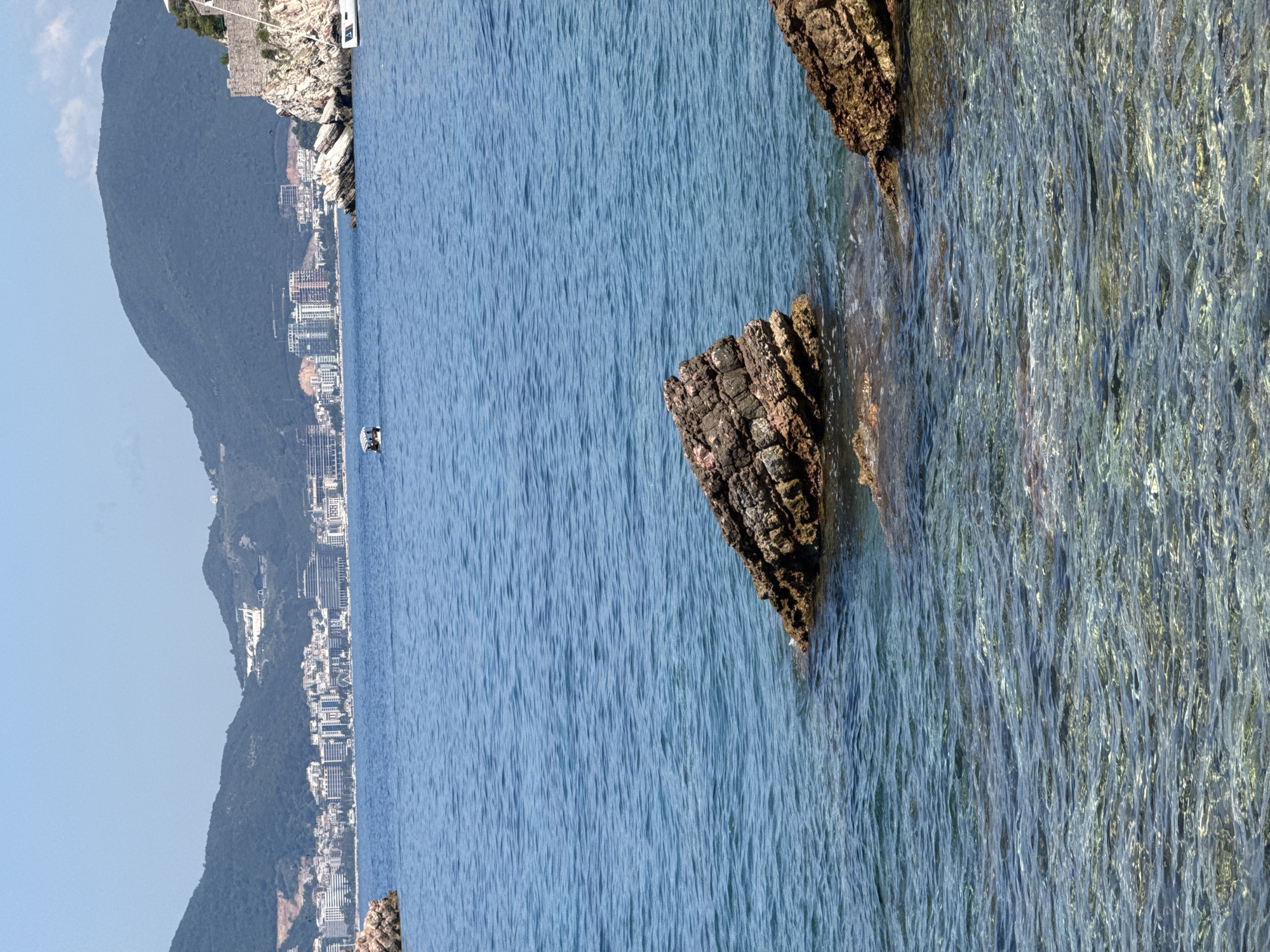 Sveti Stefan buzzes with boats, paddleboards, and coastal activity