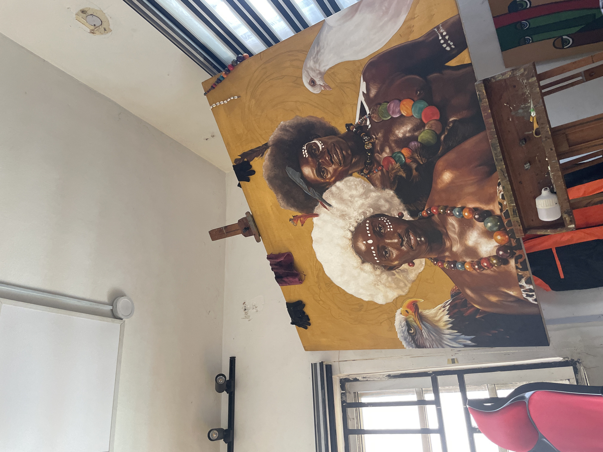 Artist studio documented in Ado, Nigeria with unfinished traditional painting