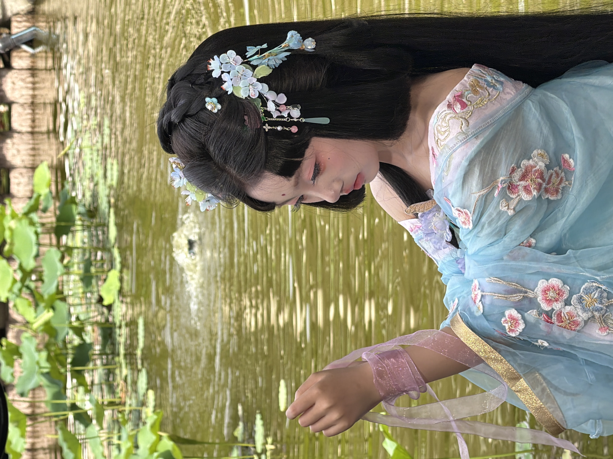 Woman documented in multiple outfit changes during Chongqing photo session