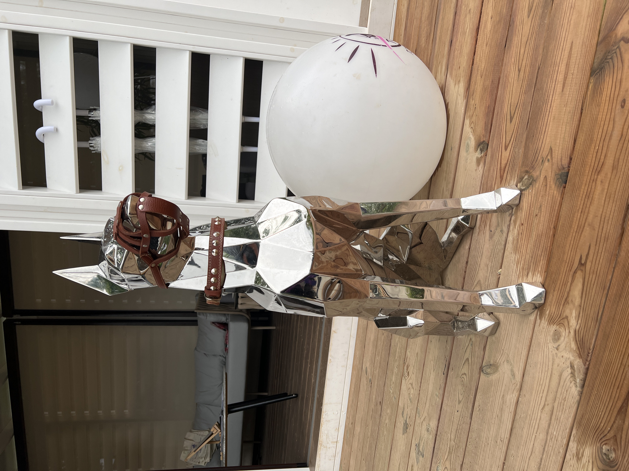 Chrome dog sculpture and styled interiors at a Yakunino venue