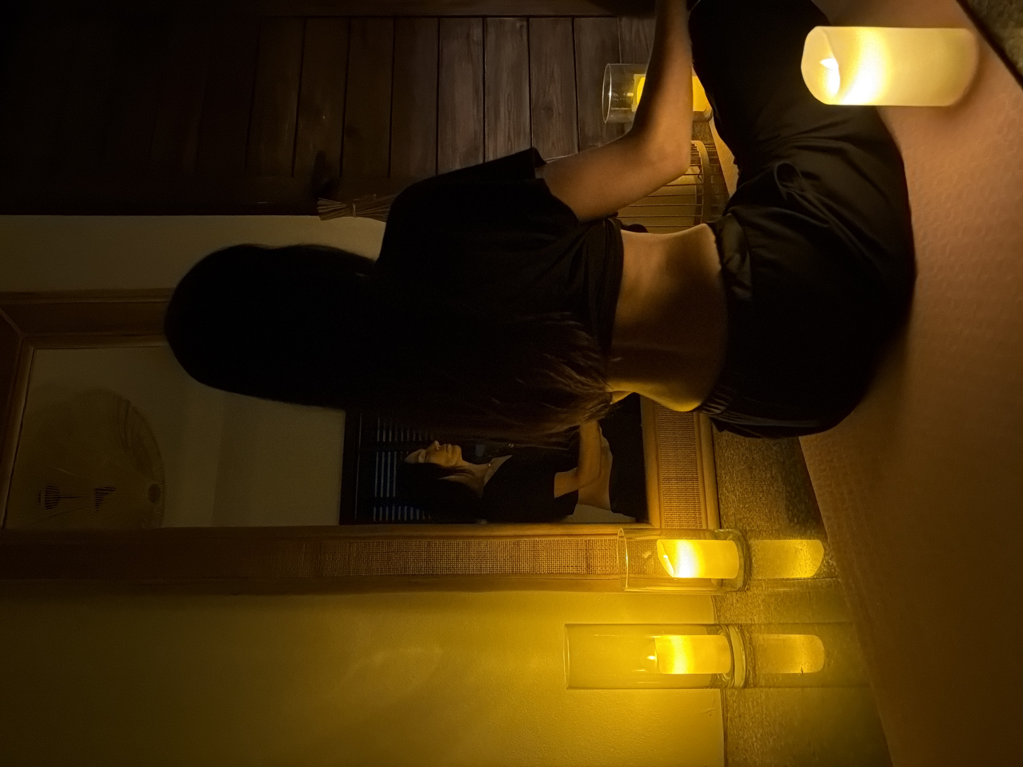 Candlelit meditation session in a dim Ko Samui room