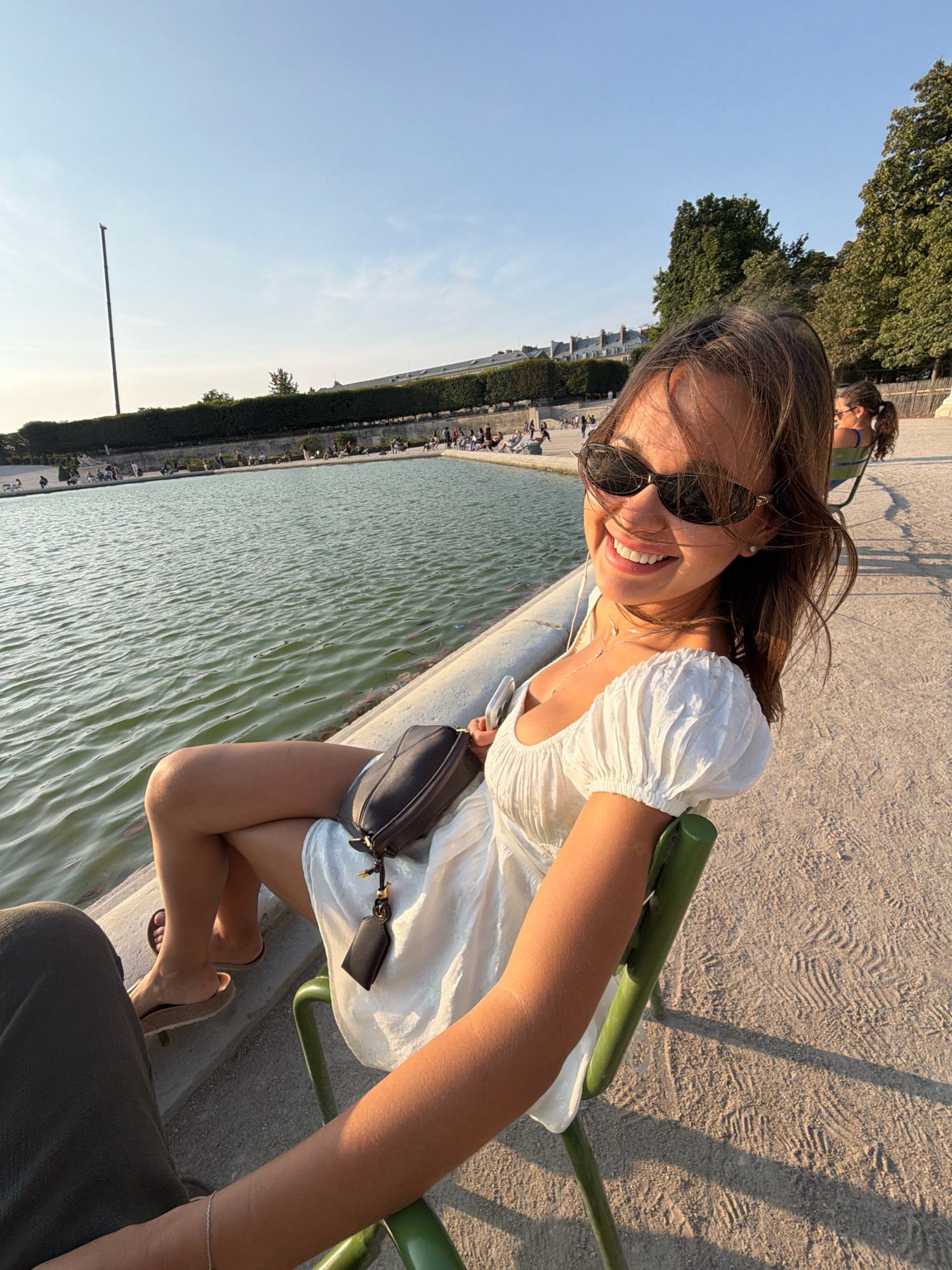 White dress, Paris afternoon: waterside rest and a swaying ladder