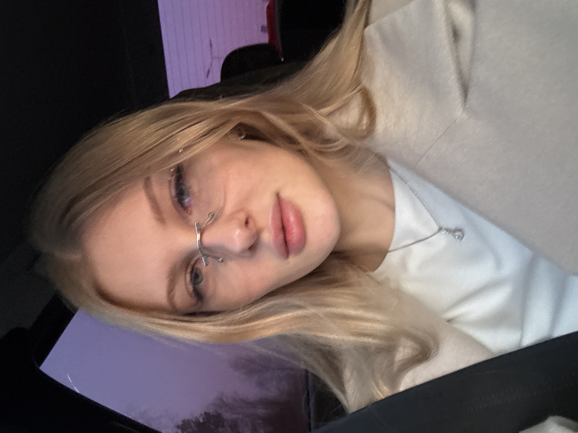 Woman with unique nose piercing photographed in car, Perm