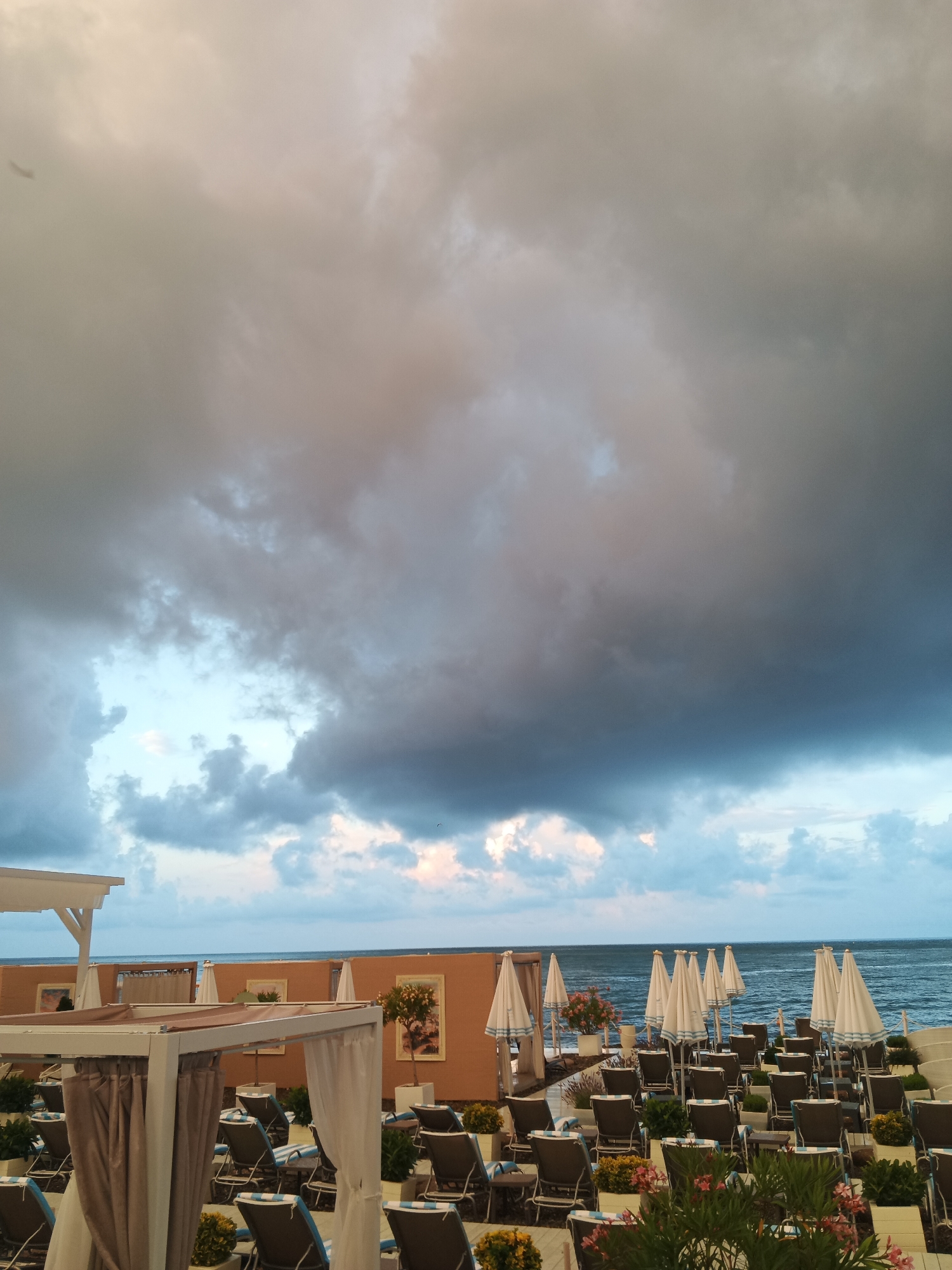 Storm clouds gather over an empty Sochi beach resort