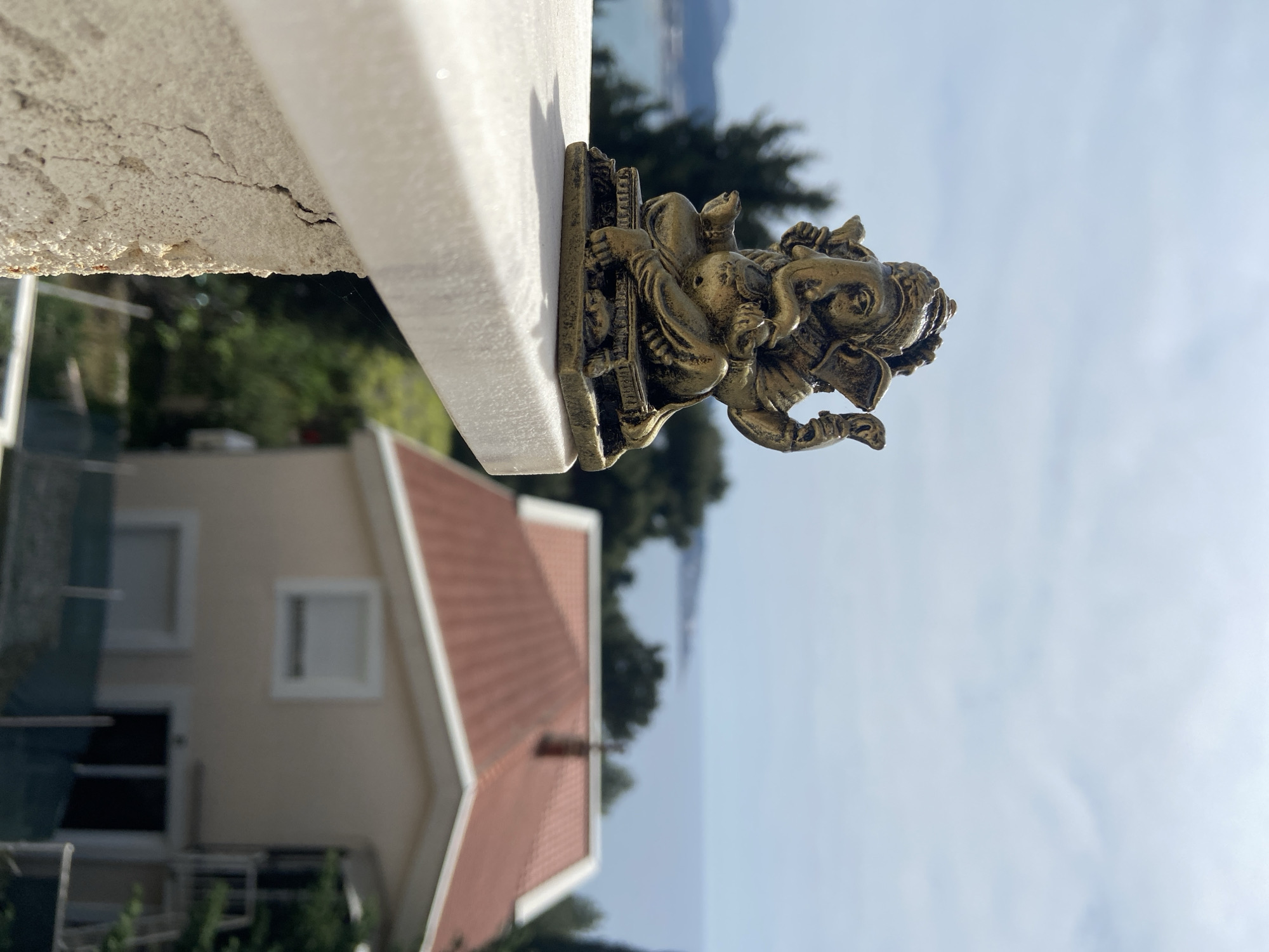 Toy figurines photographed on ledge overlooking Montenegro coast