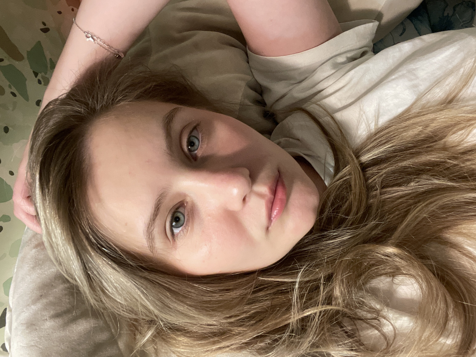Afternoon in bed with a tabby kitten
