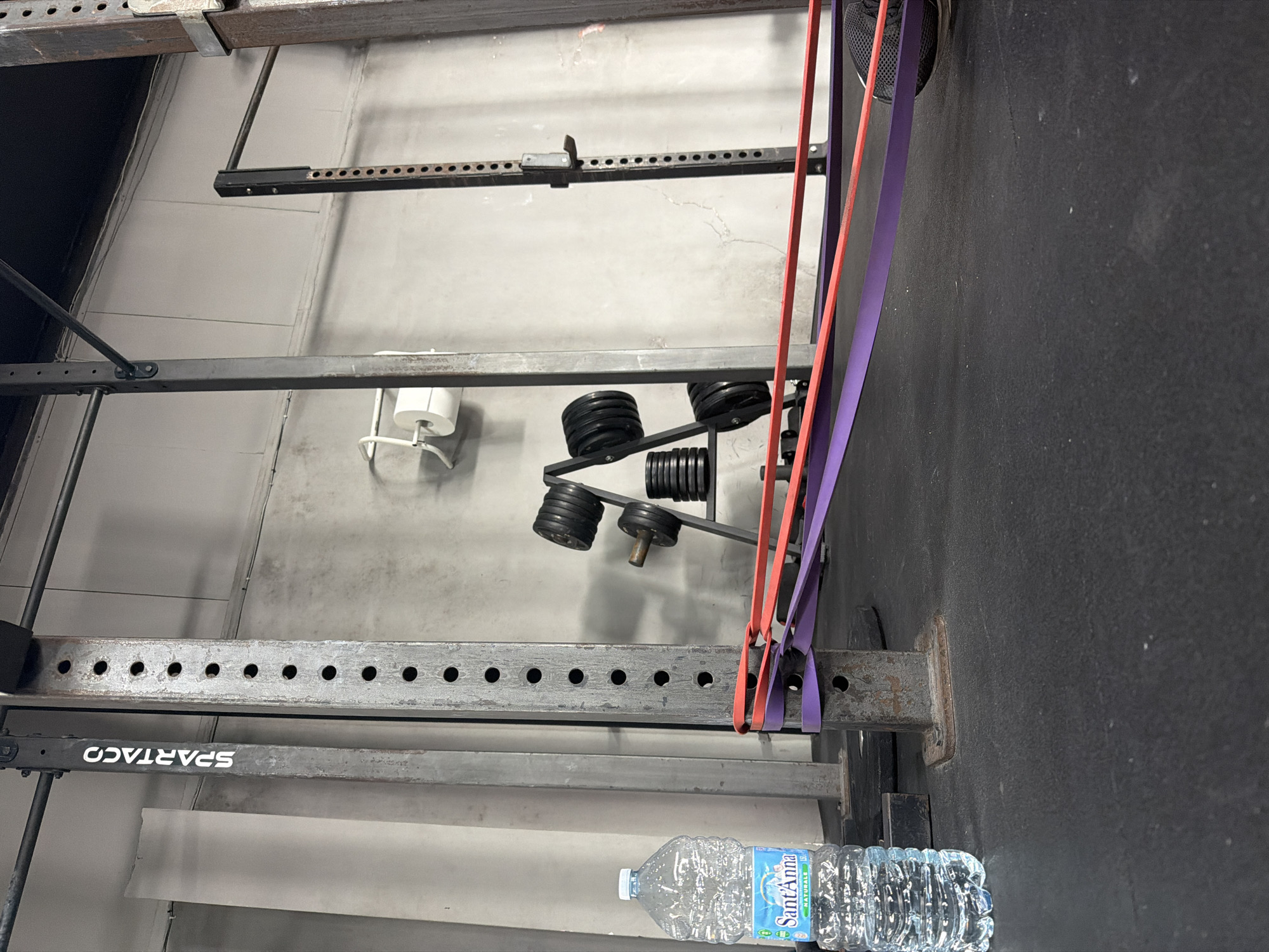 Gym interior documented in Lecce, Italy showing equipment and branding