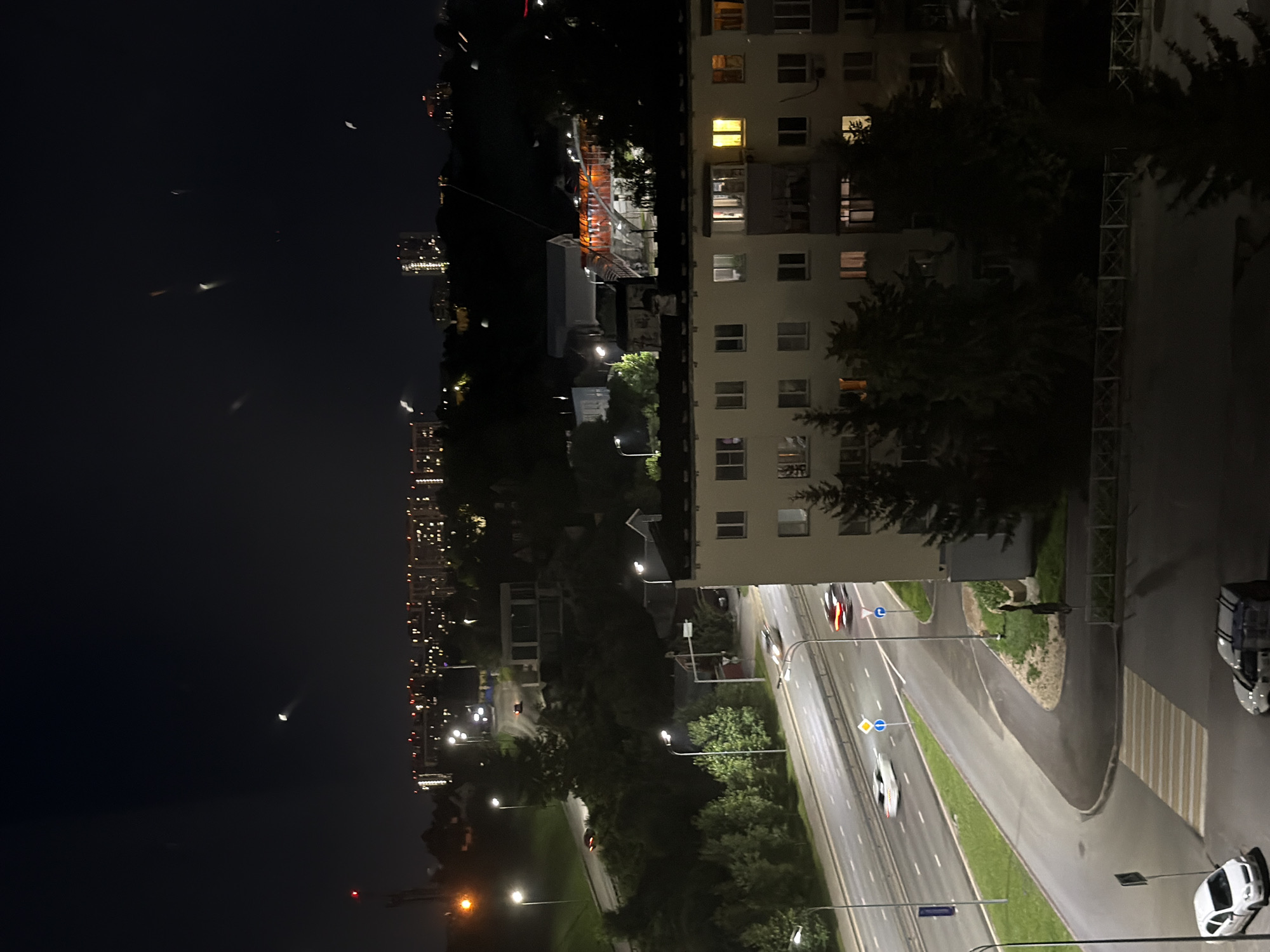 Kazan city street at night, with sculpture and residential blocks
