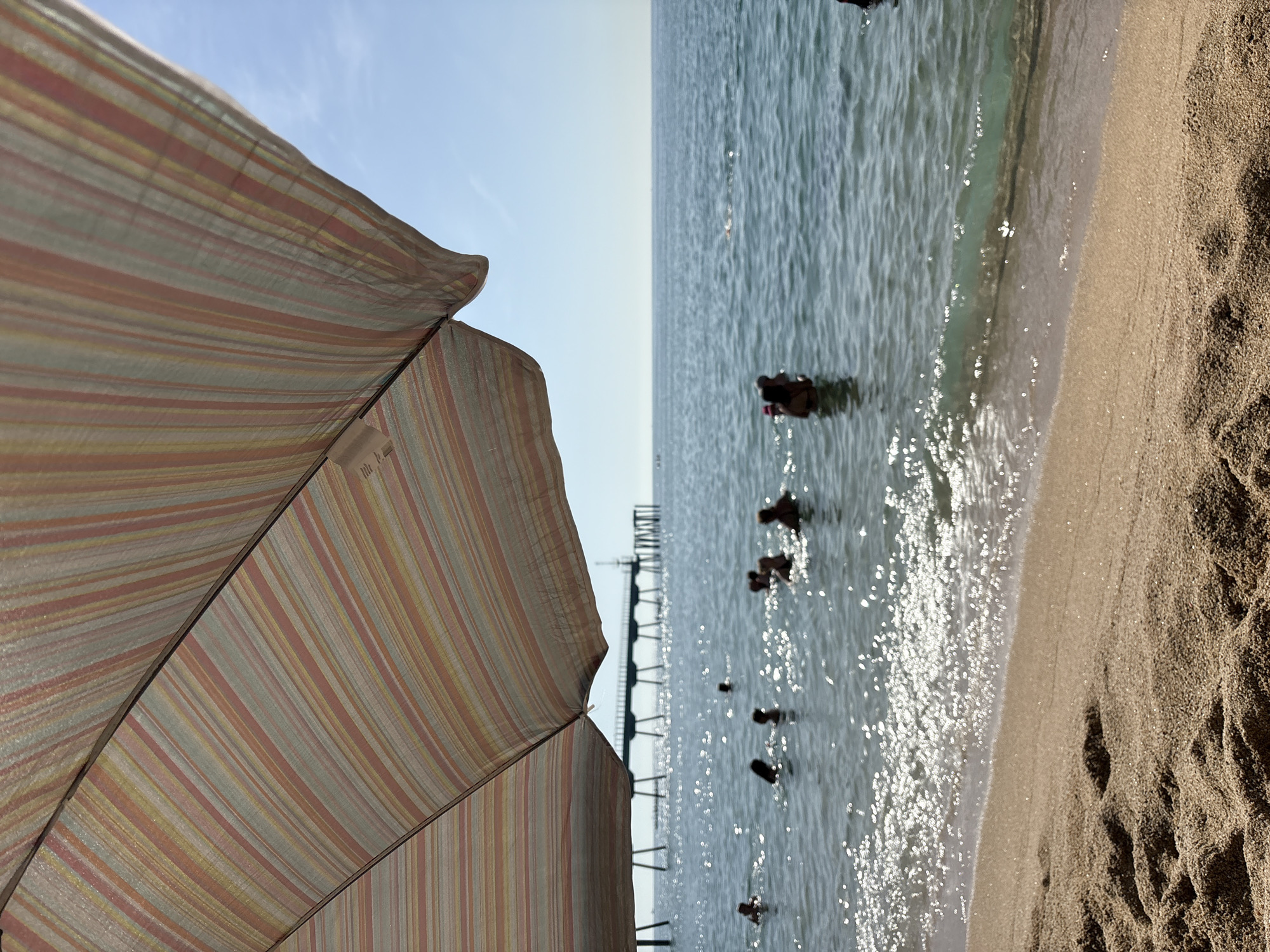Laid-back beach day with water sports and shoreline details