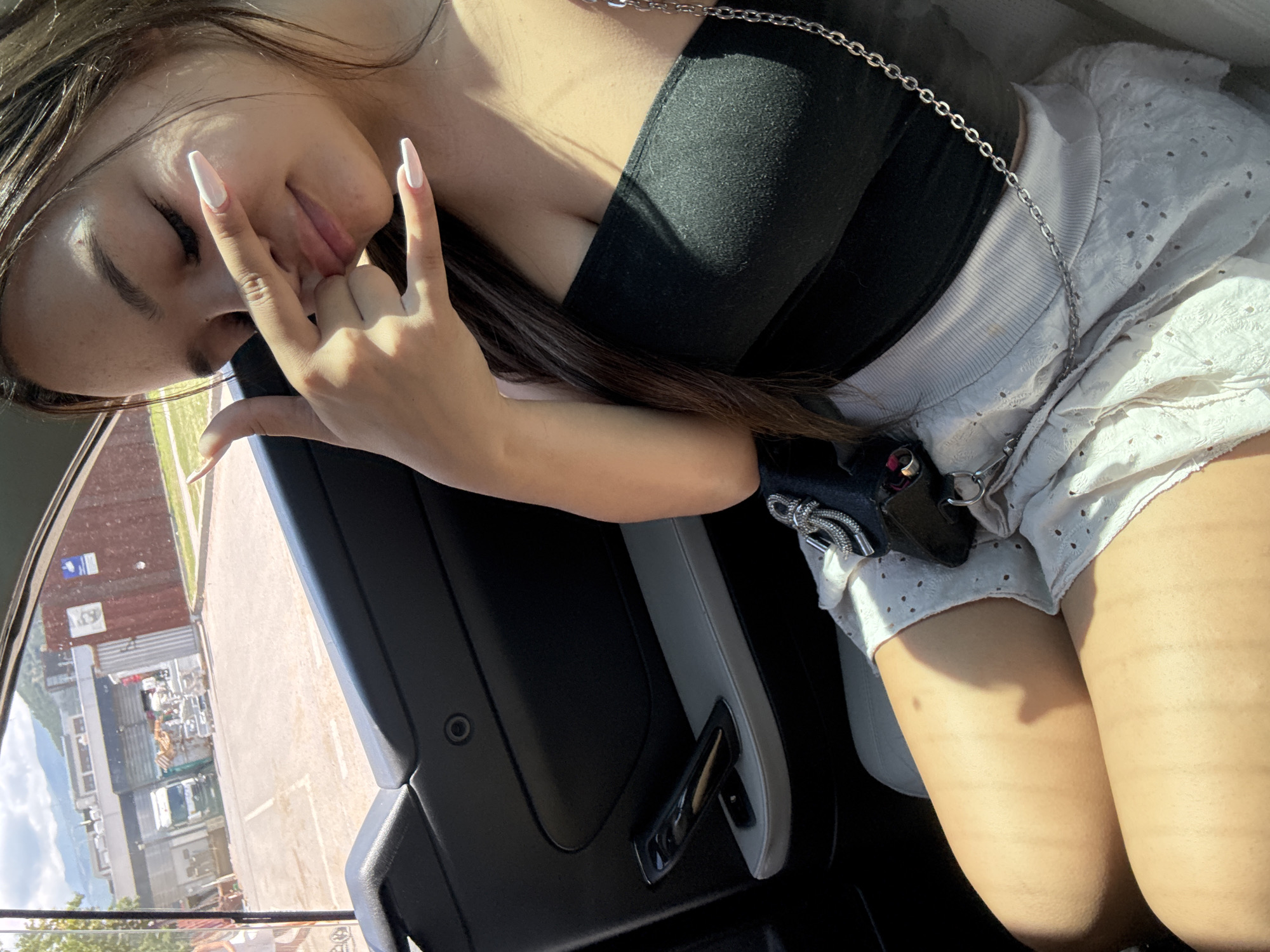 Passenger seat moment near Blagoevgrad, casual hand gesture mid-ride