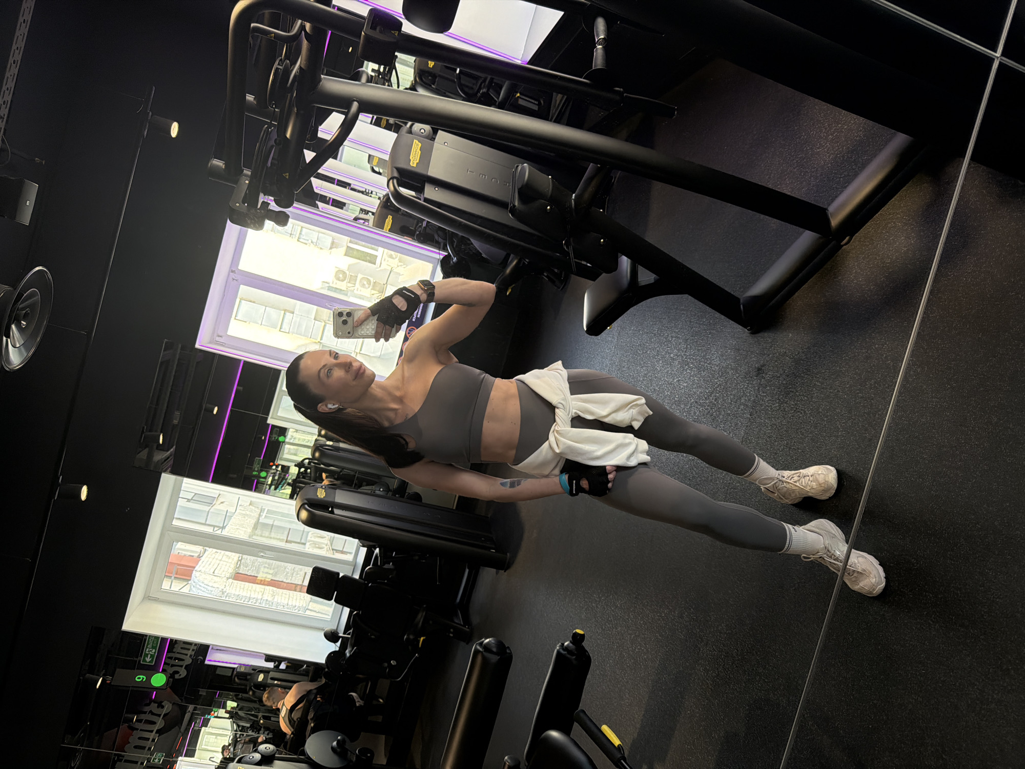 Woman Takes Selfies During Workout Session in Perm