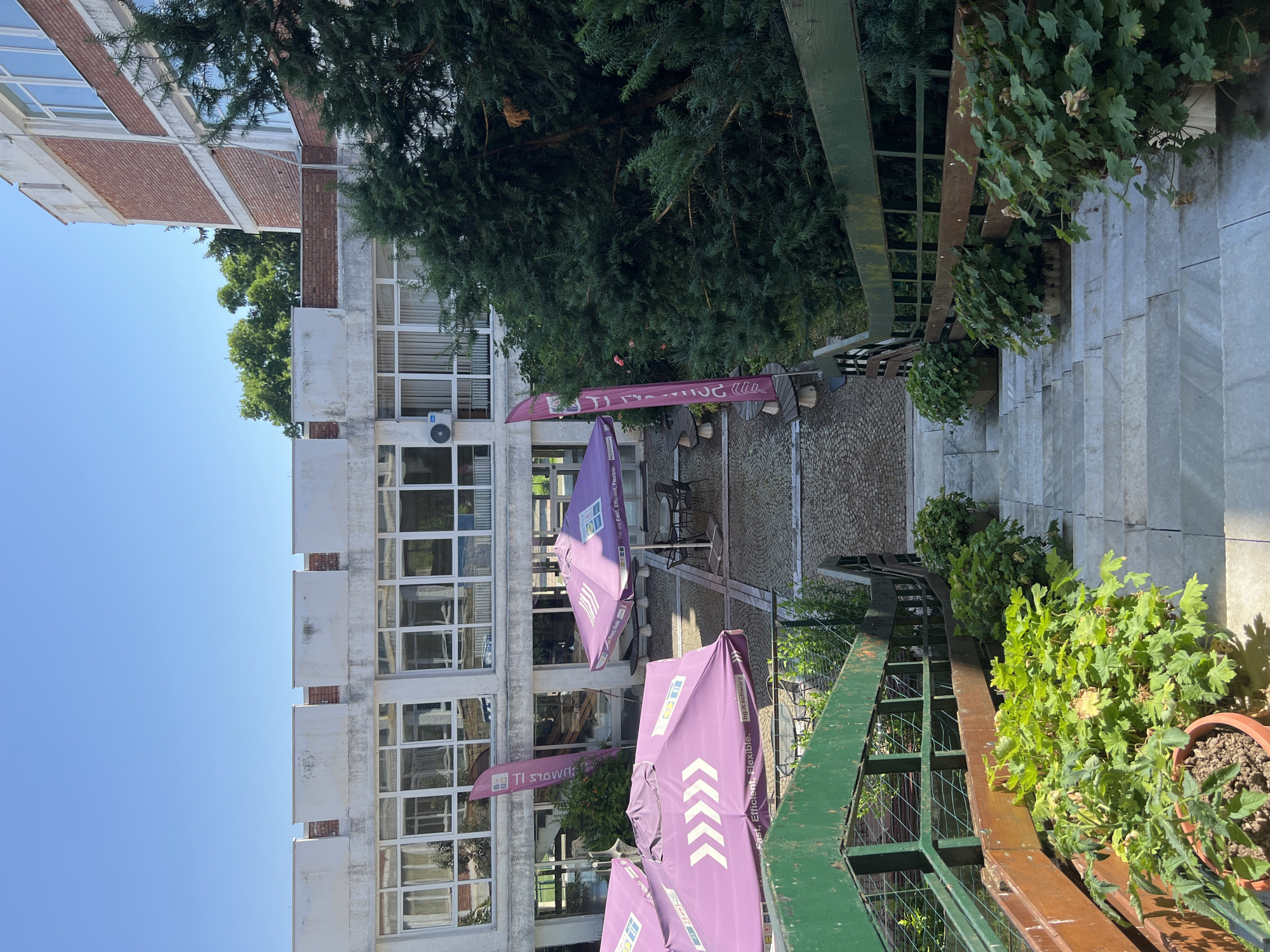 Outdoor staircase and robot mural at a building in Pravets