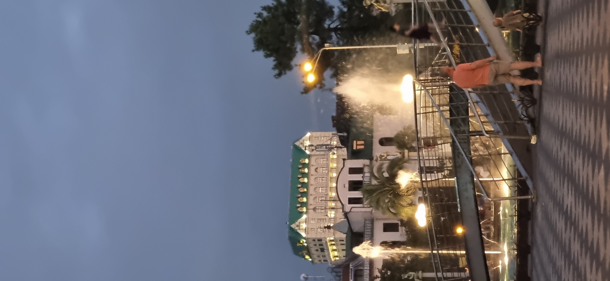 Batumi plaza comes alive around a fountain at dusk