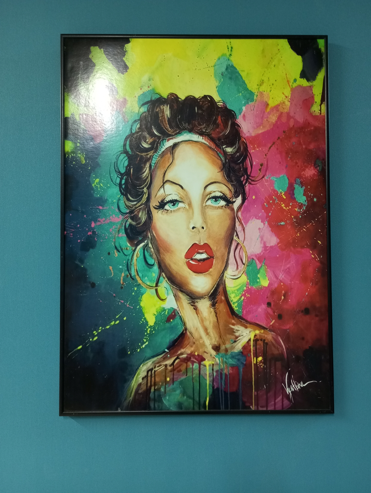 Woman takes selfie with colorful portrait painting in Russia