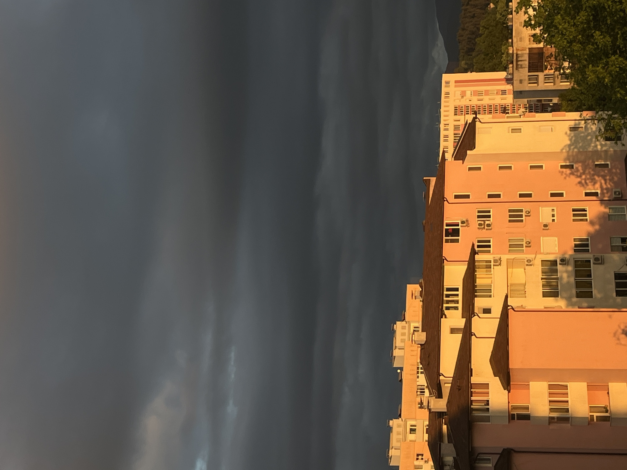 Stormy skies create pink lighting over Gabrovo apartments