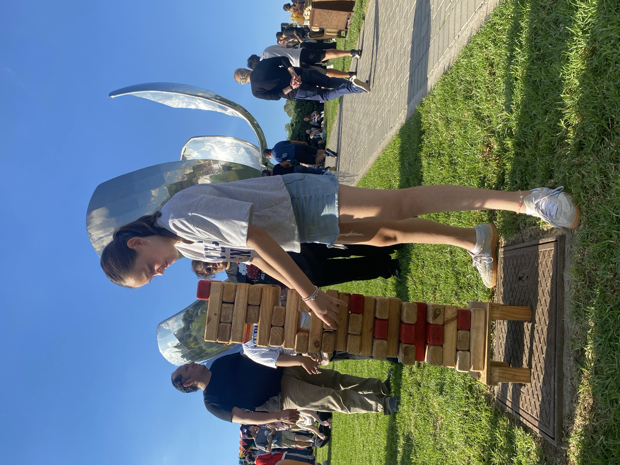 Woman plays giant Jenga outdoors in Buenos Aires