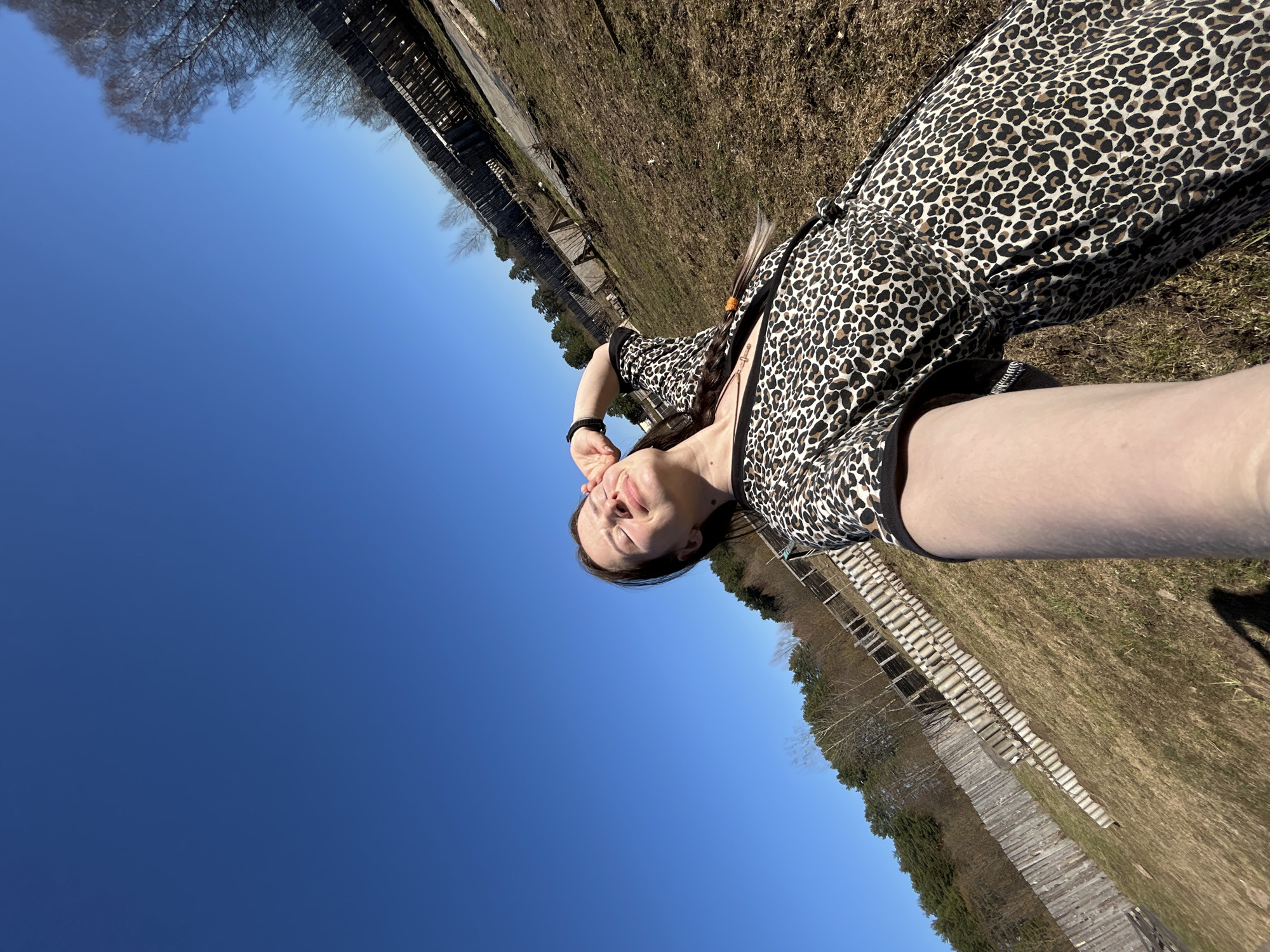 Woman takes selfie outdoors in Rusalevka on sunny afternoon