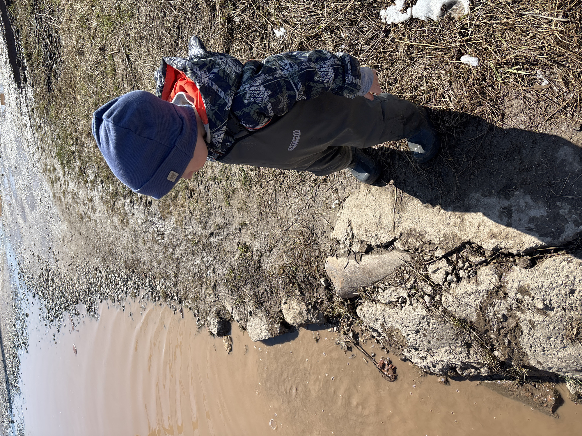 Spring flooding creates muddy street conditions in Ferma, Russia