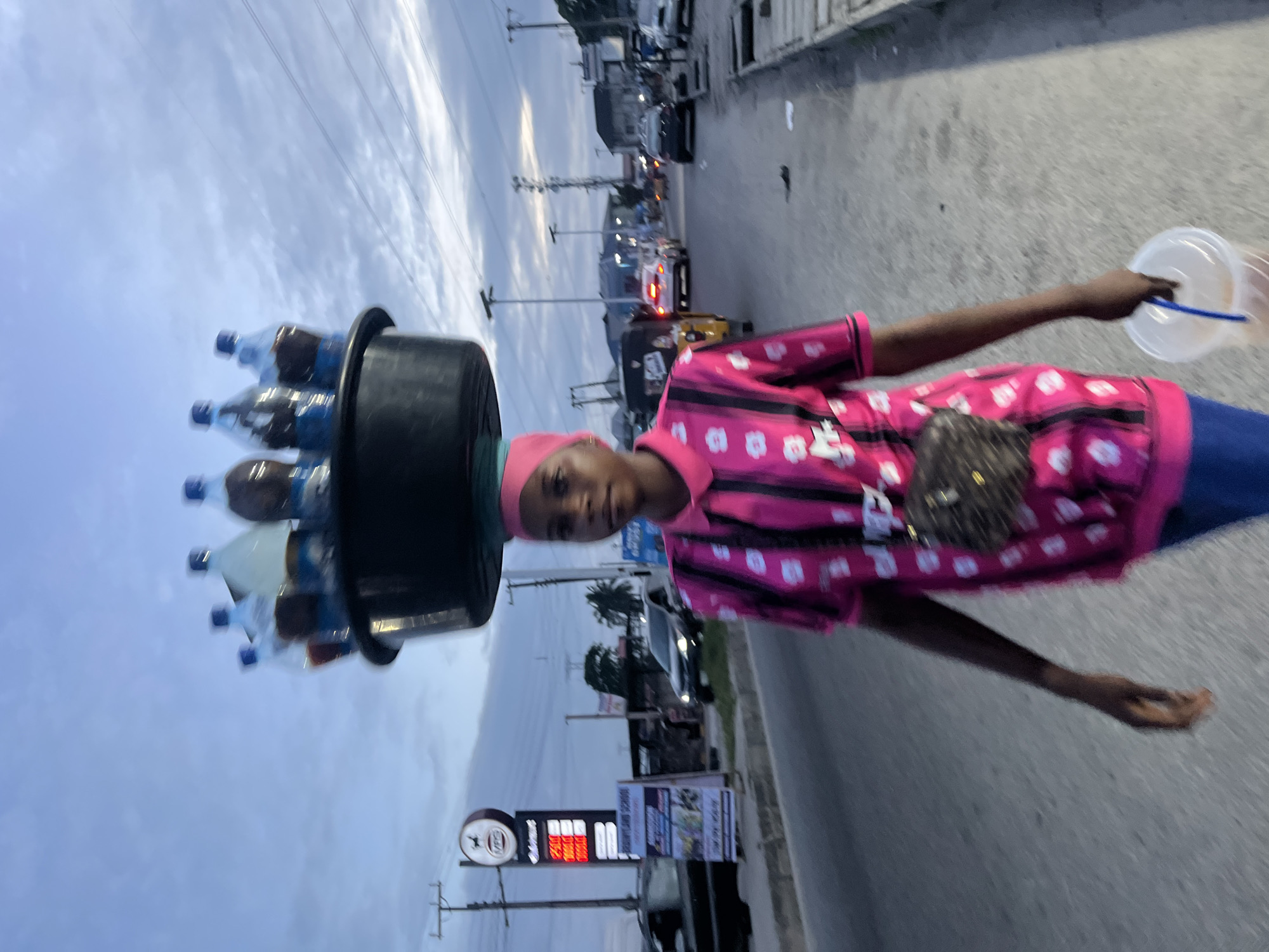 Street life and transport at dusk in Ado, Nigeria