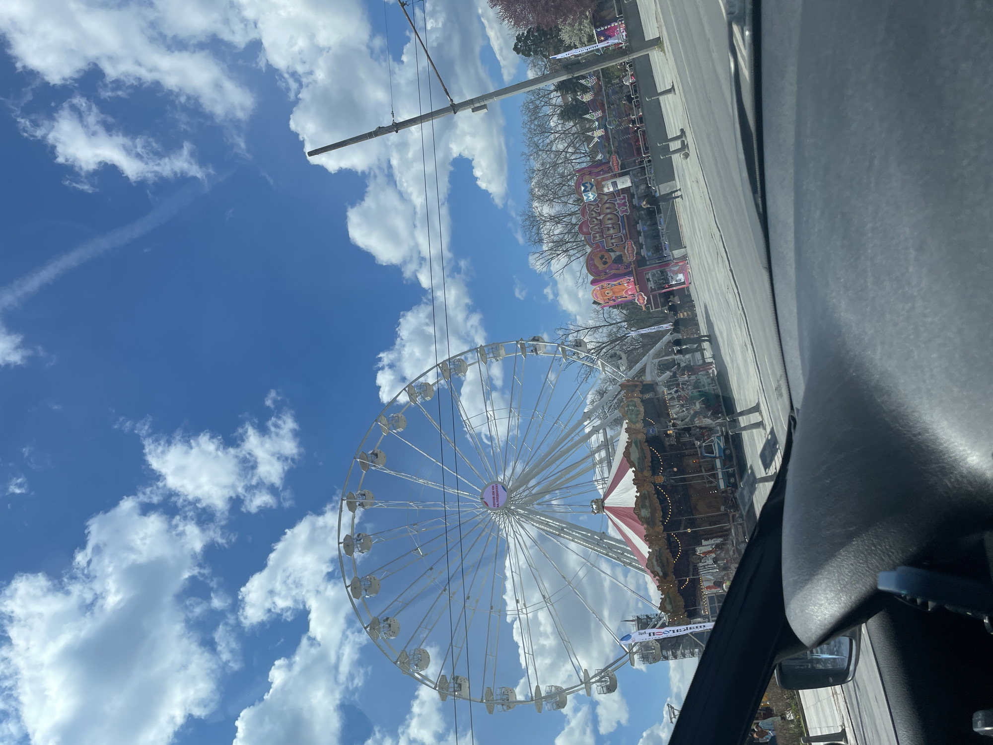 Carnival attractions and historic architecture observed in Sofia