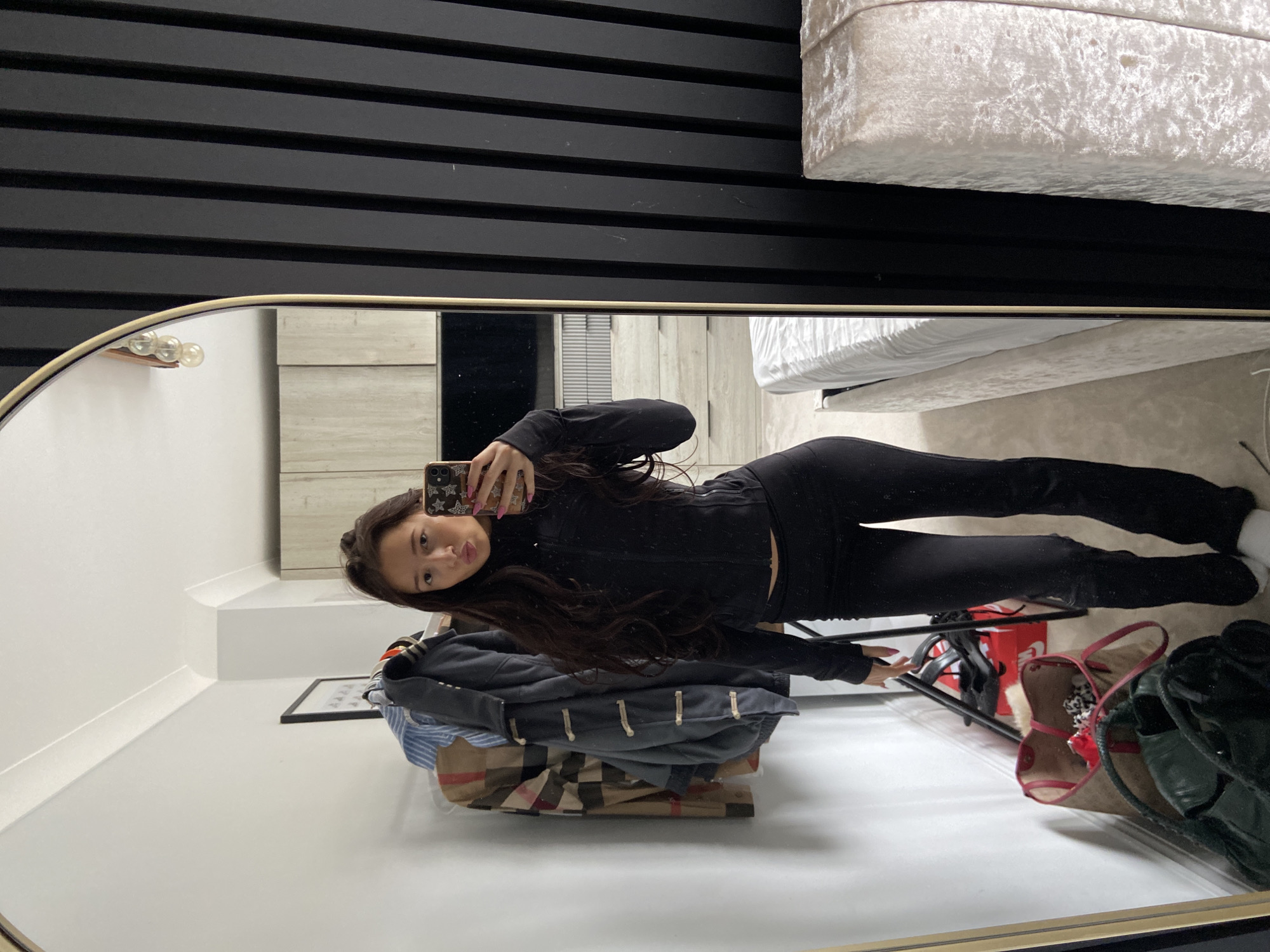 Woman takes morning selfies in bedroom