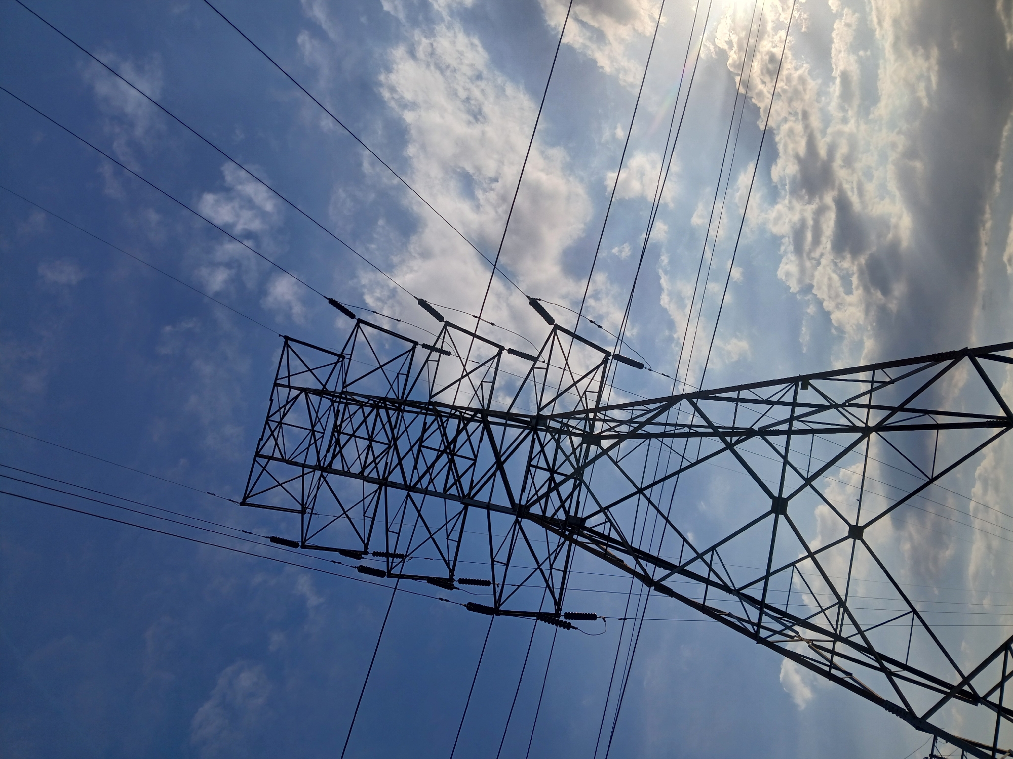 Electricity pylon photographed against cloudy sky in Ciudad Guayana