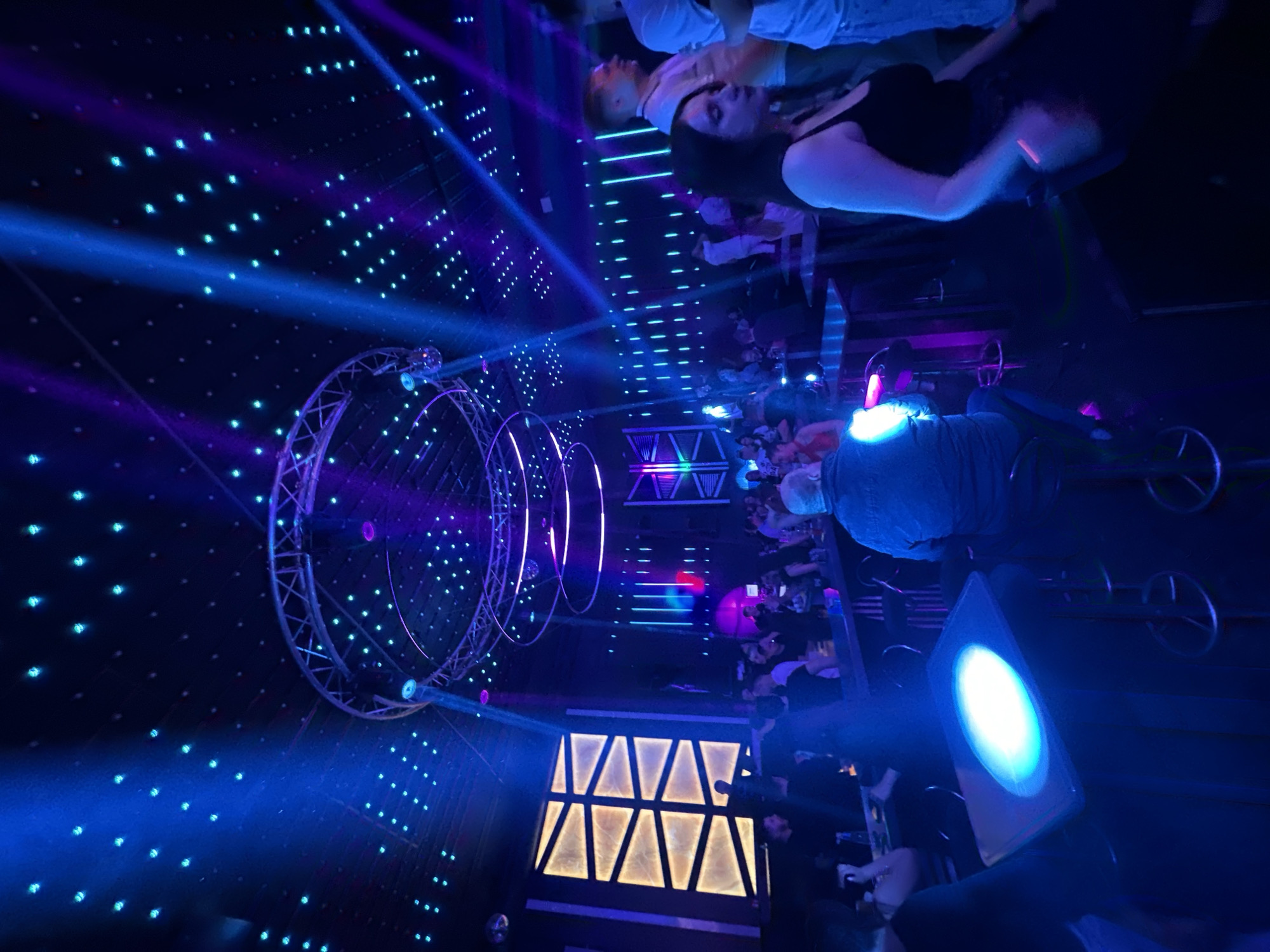 Nightclub scene with patrons and colorful lighting in Gabrovo