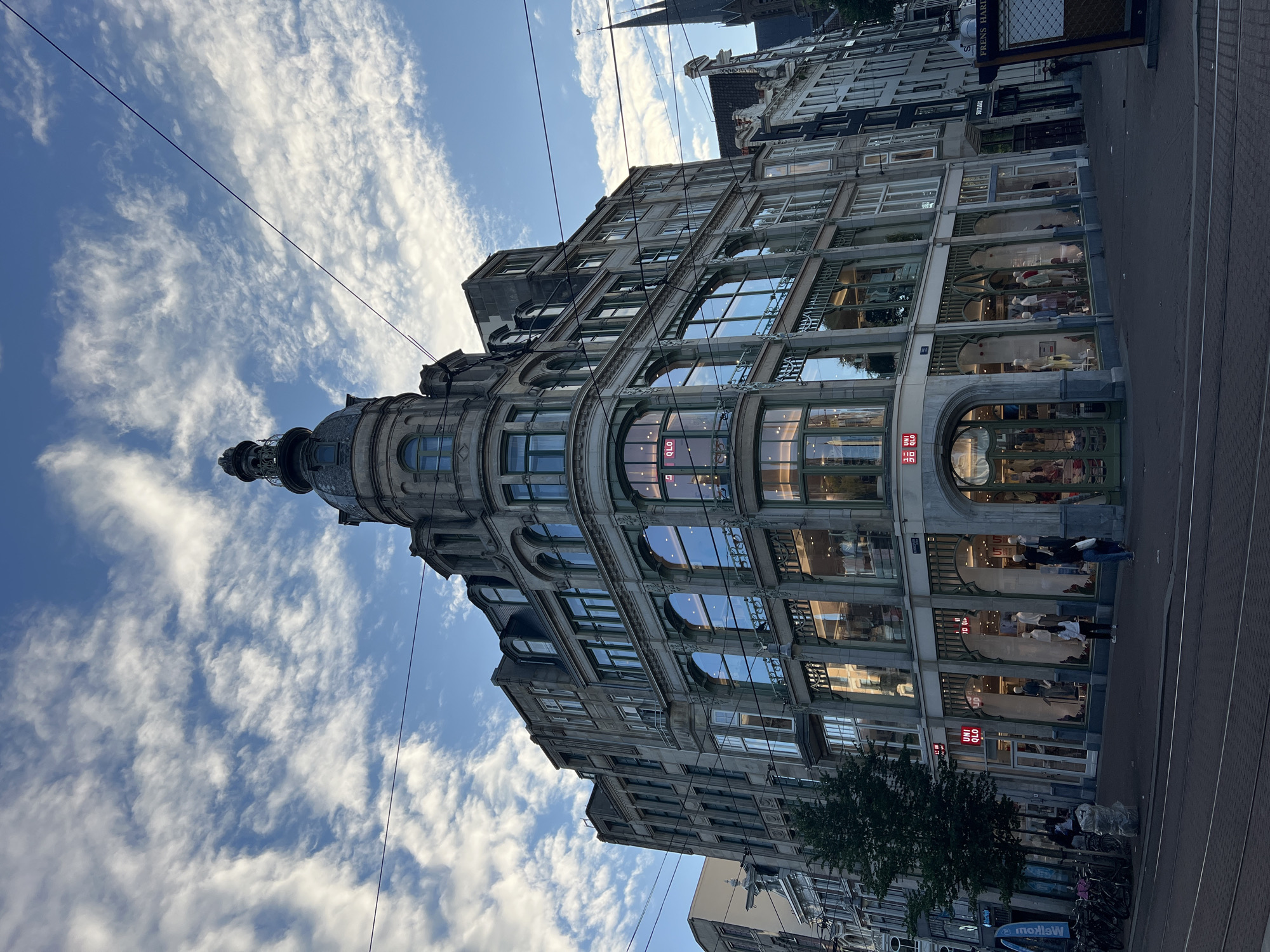 Amsterdam canals and corner architecture on a June evening