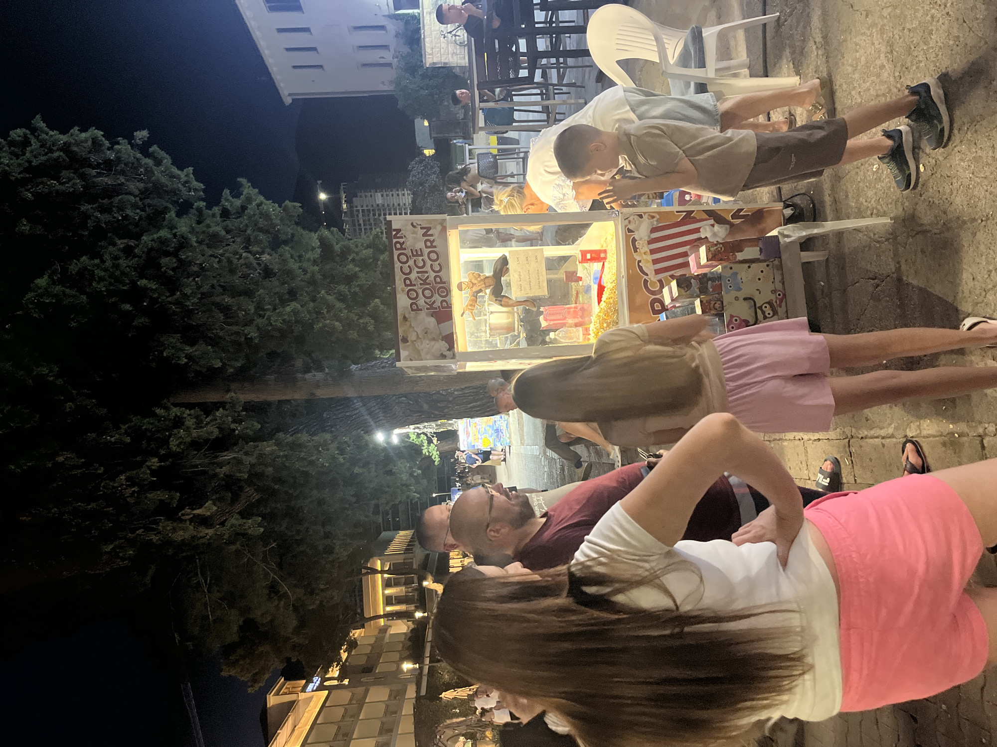 Coastal evening: waterfront dining, old stone walls, and city streets