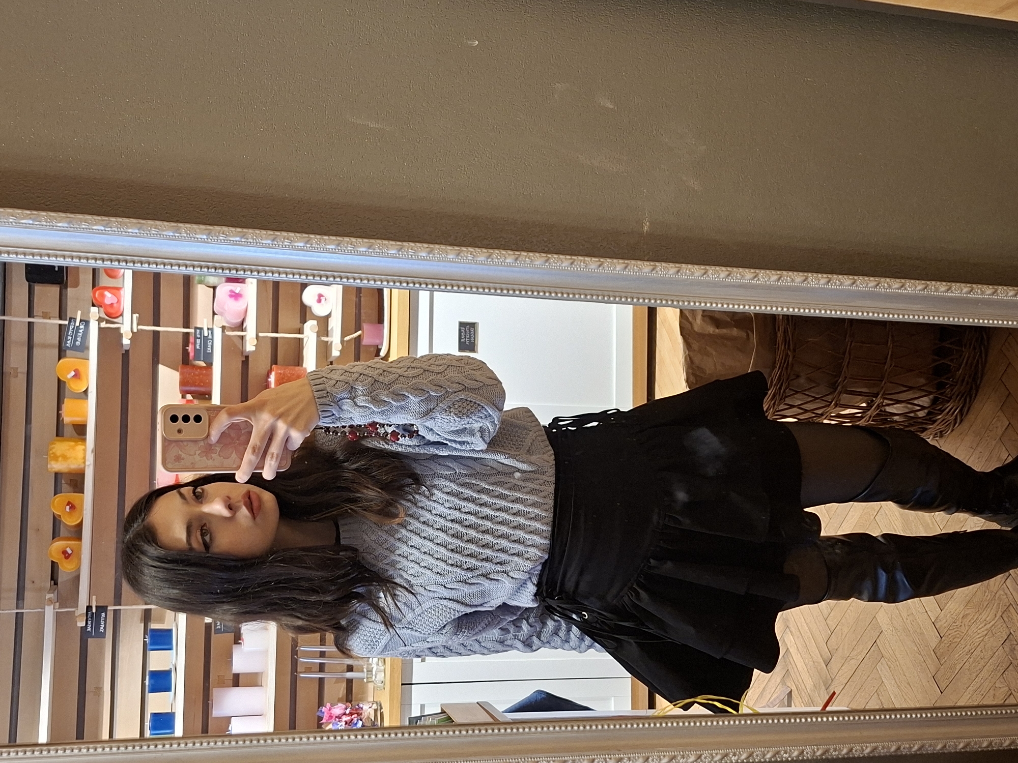 Woman takes mirror selfie in spring outfit