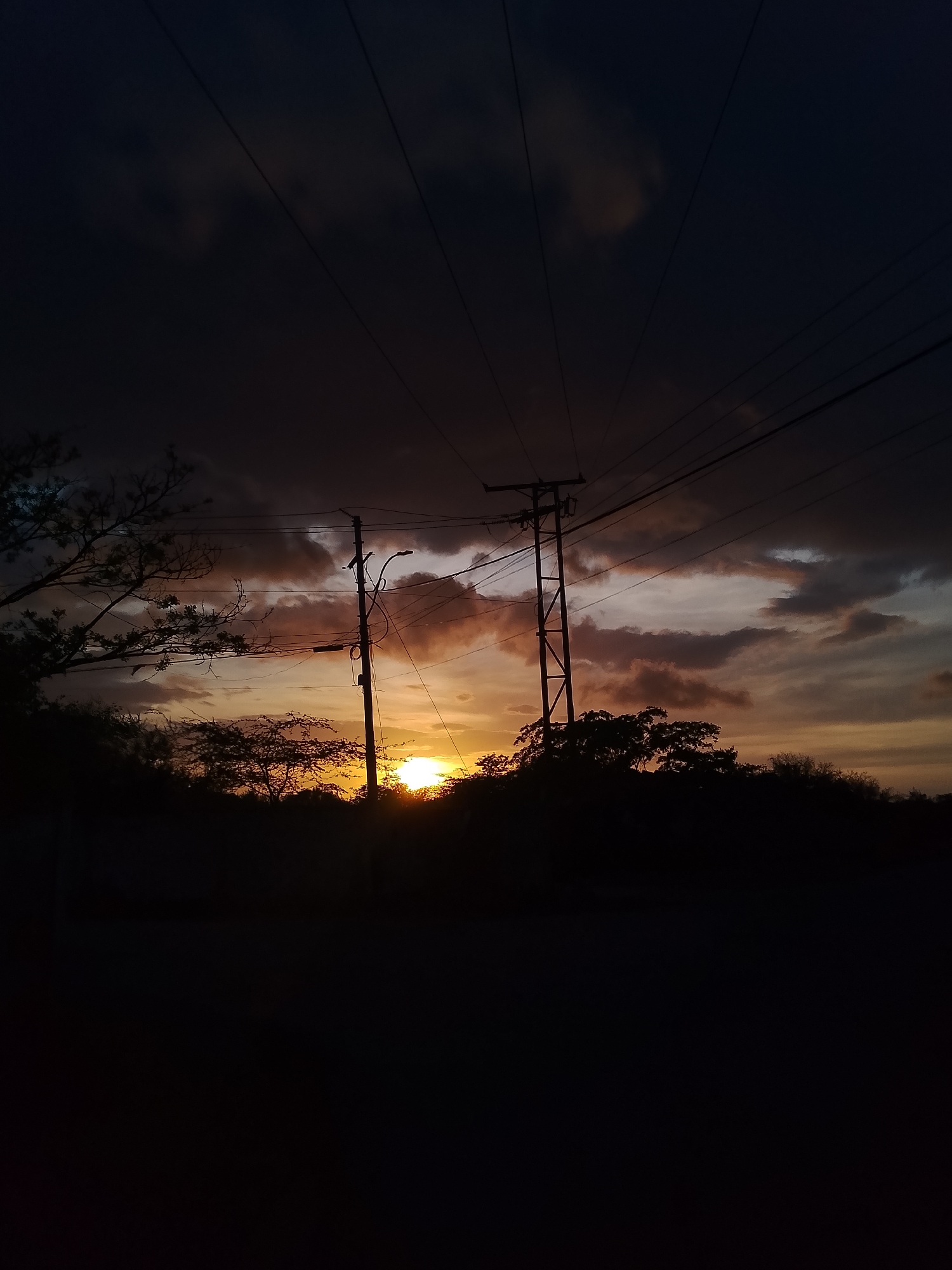 Dramatic sunset photographed across Santa Ana, Venezuela streets