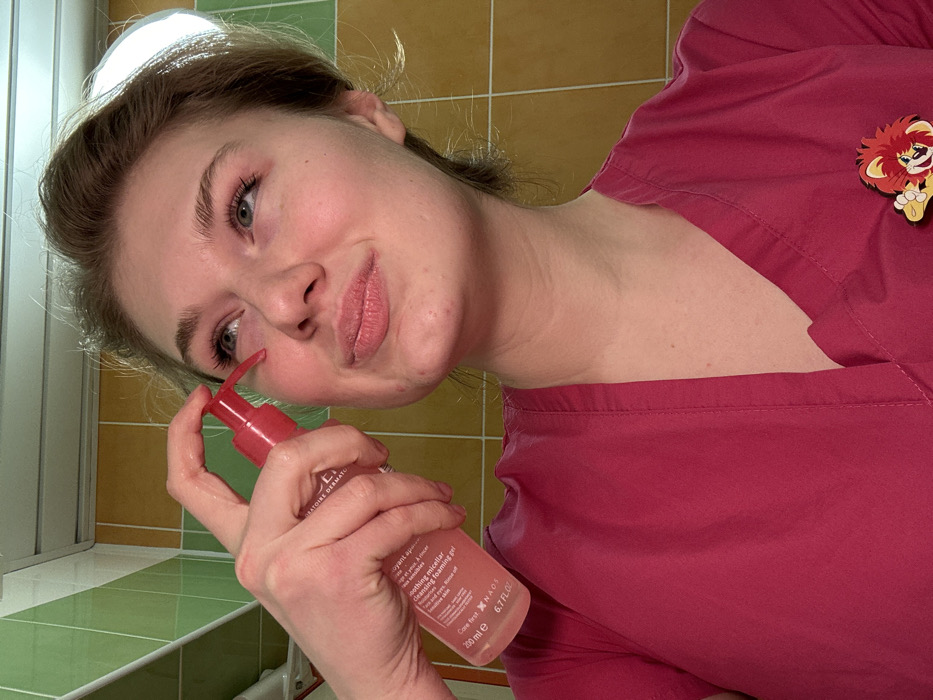Healthcare worker documents evening skincare routine in Kazan bathroom