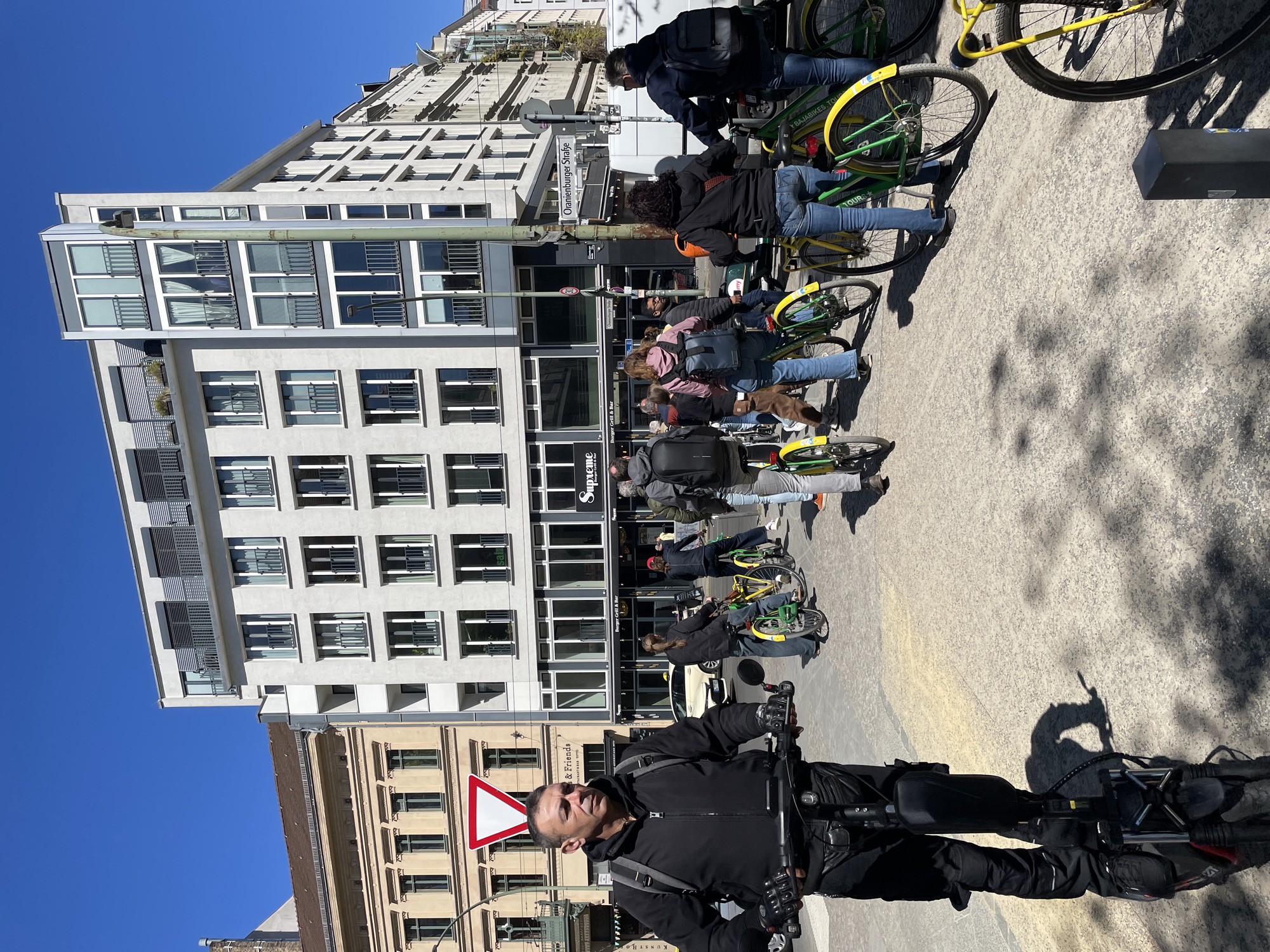 Cycling group gathers near Berlin's New Synagogue on sunny day