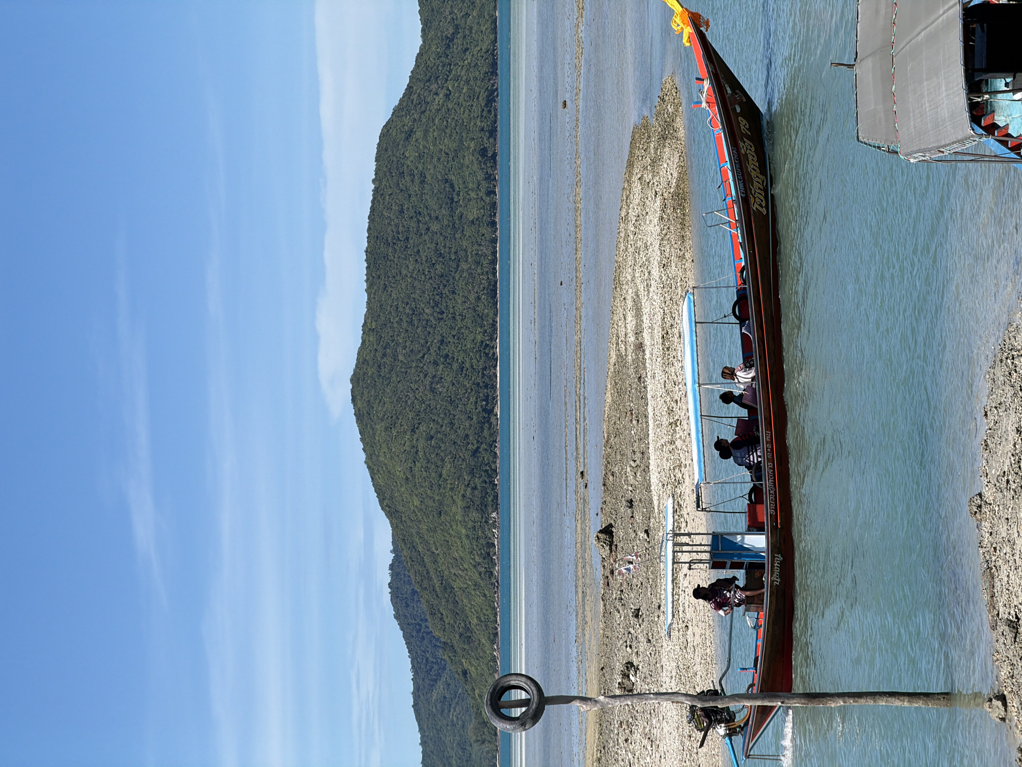 Longtail boats and beach life at Baan Thong Krut