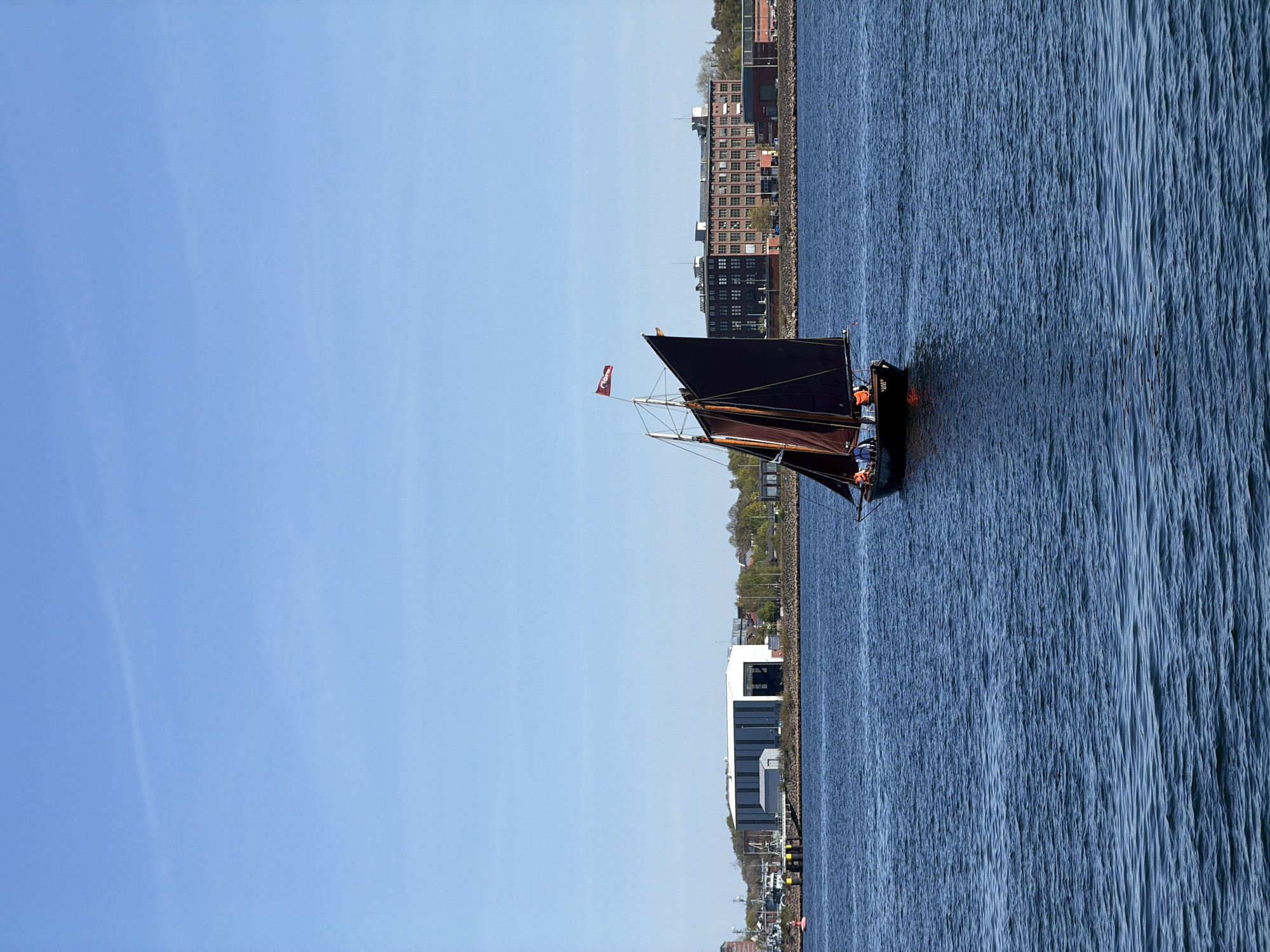 Gaff-rigged sailboat spotted sailing near Kiel under clear skies