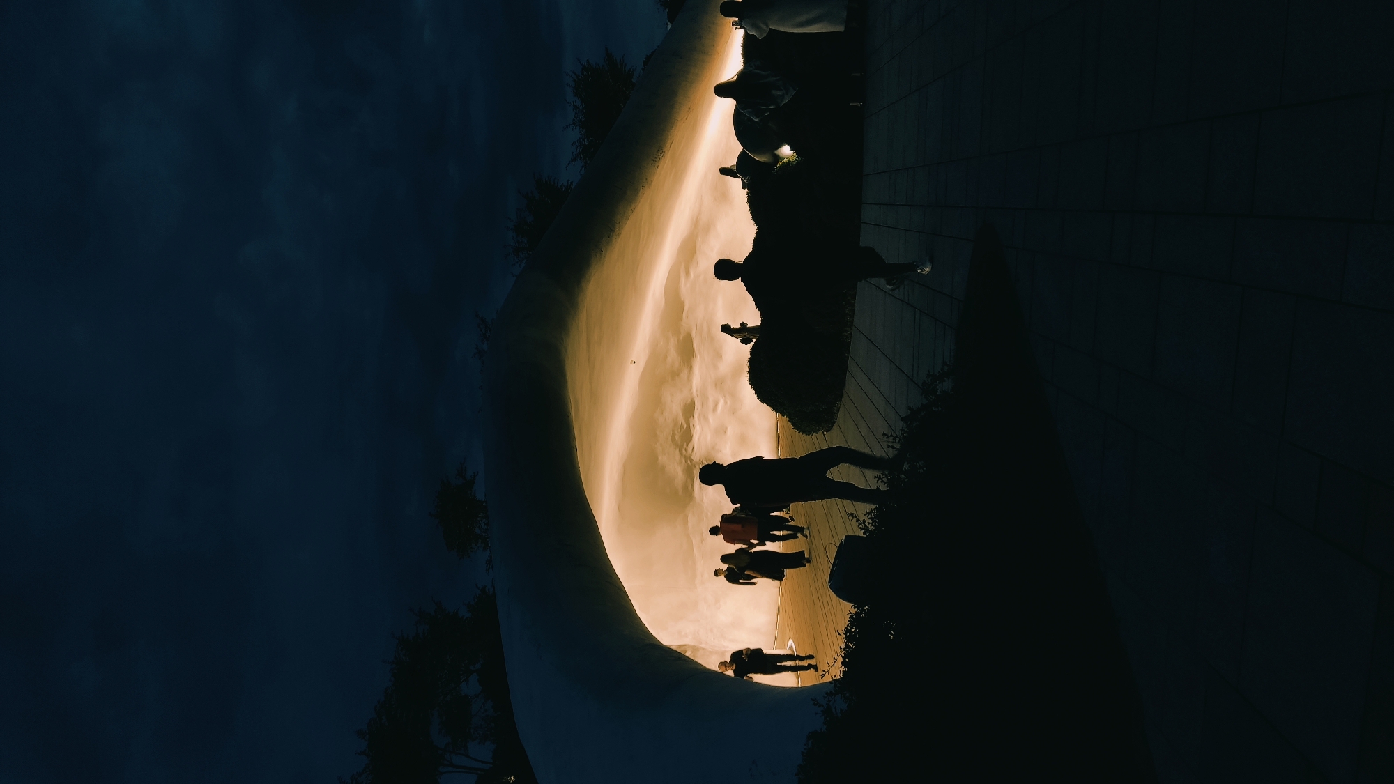 Evening visitors document illuminated modern park installations in Krasnodar