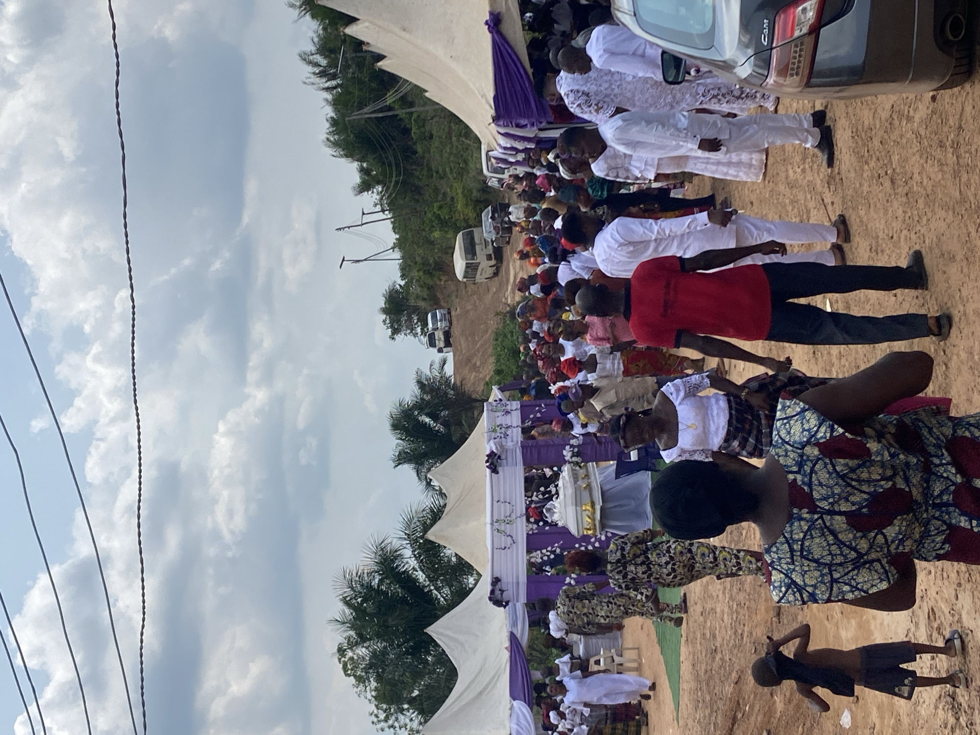 Funeral service held in Achara, Nigeria with floral decorations