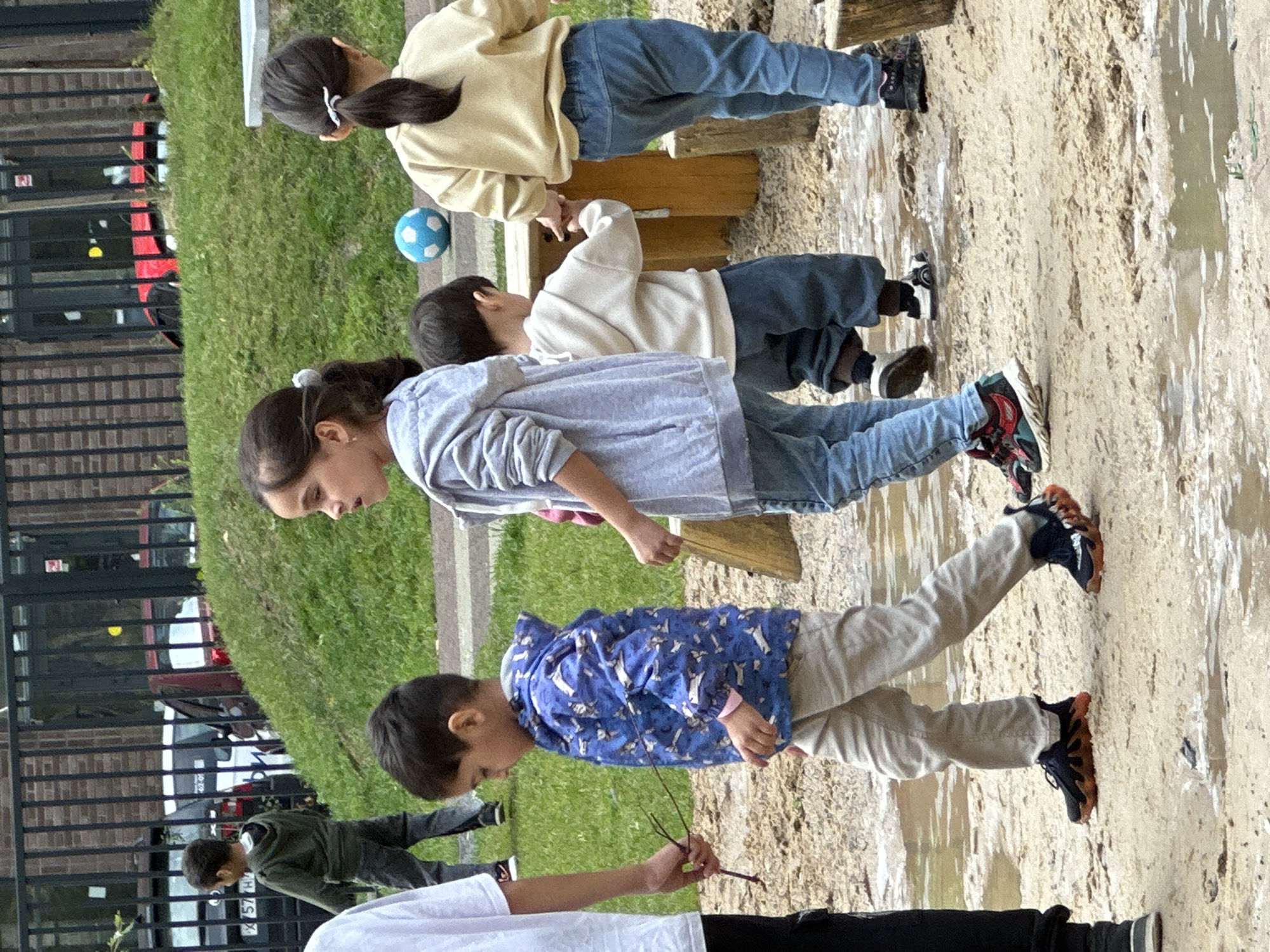 Kids at play in a Russian neighborhood playground on a summer morning