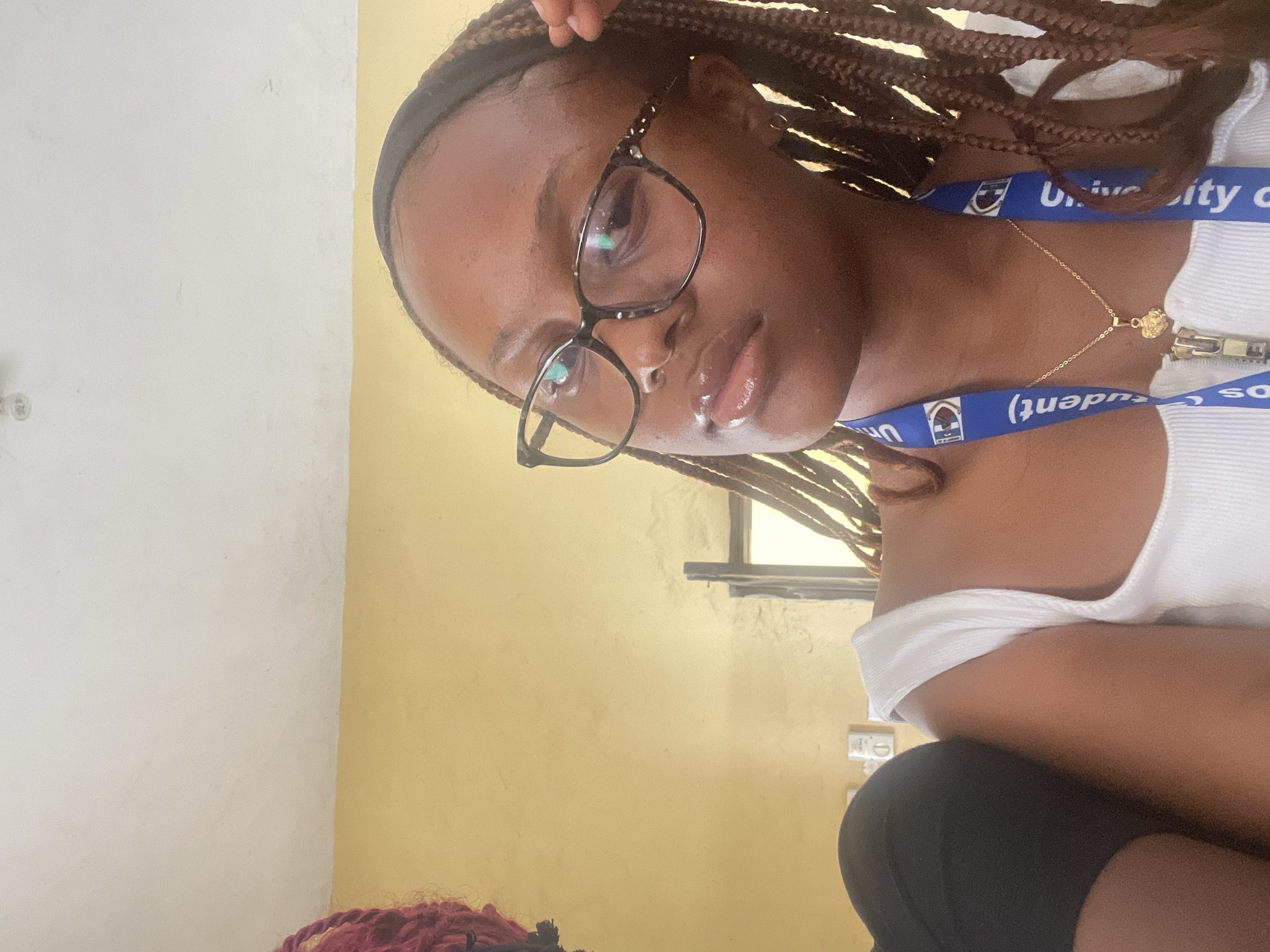 Selfie series at University of Jos, student lanyard in frame