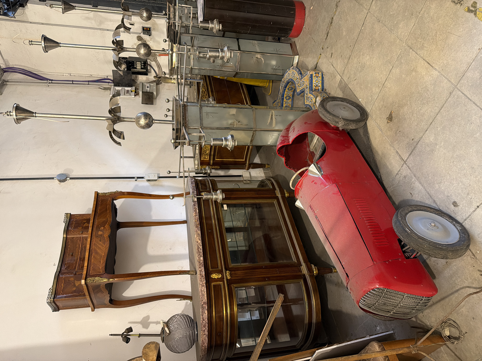 Witness documents cluttered Buenos Aires antique shop interior and exterior