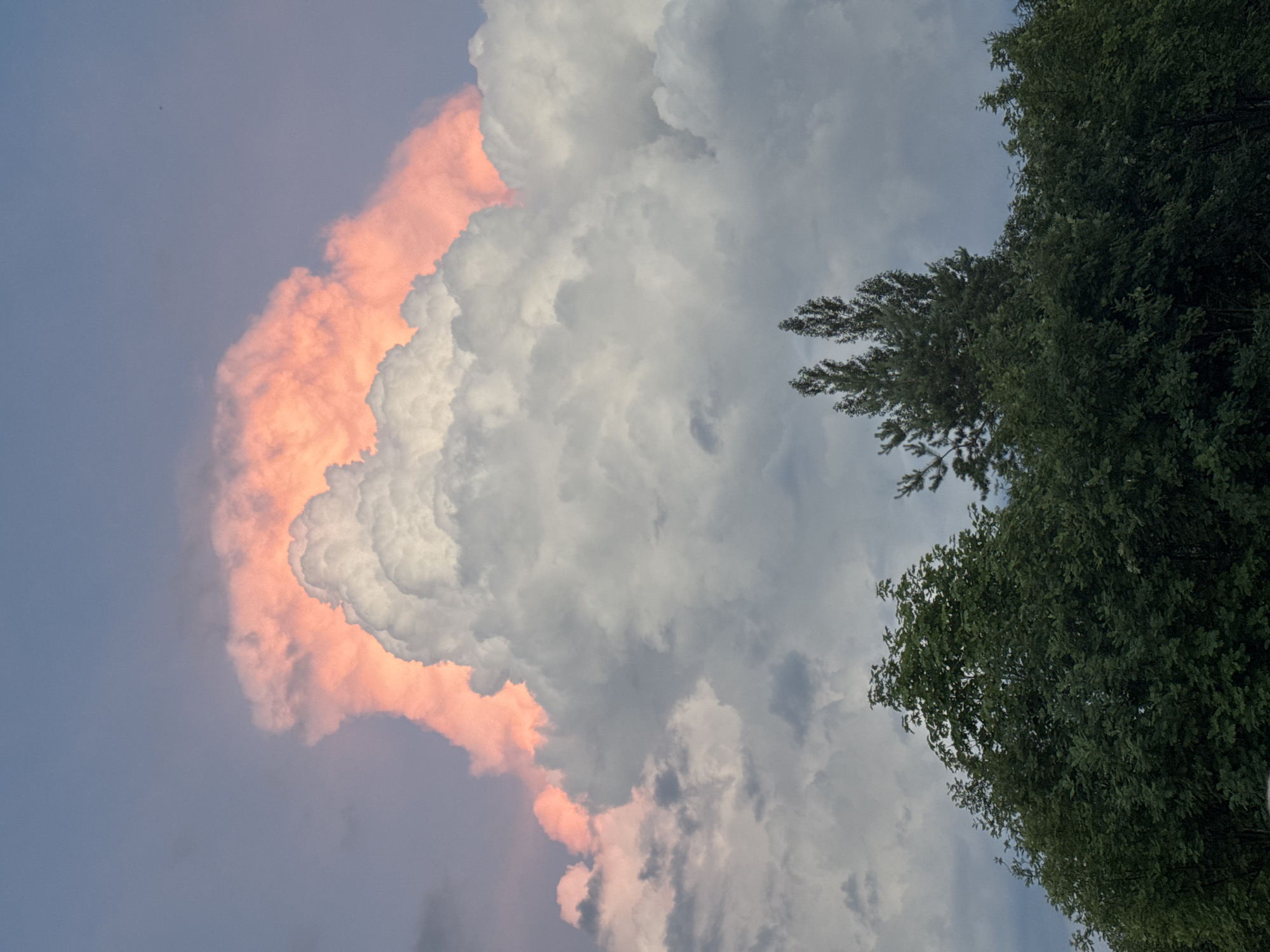 Dramatic sunset illuminates towering clouds at location 666