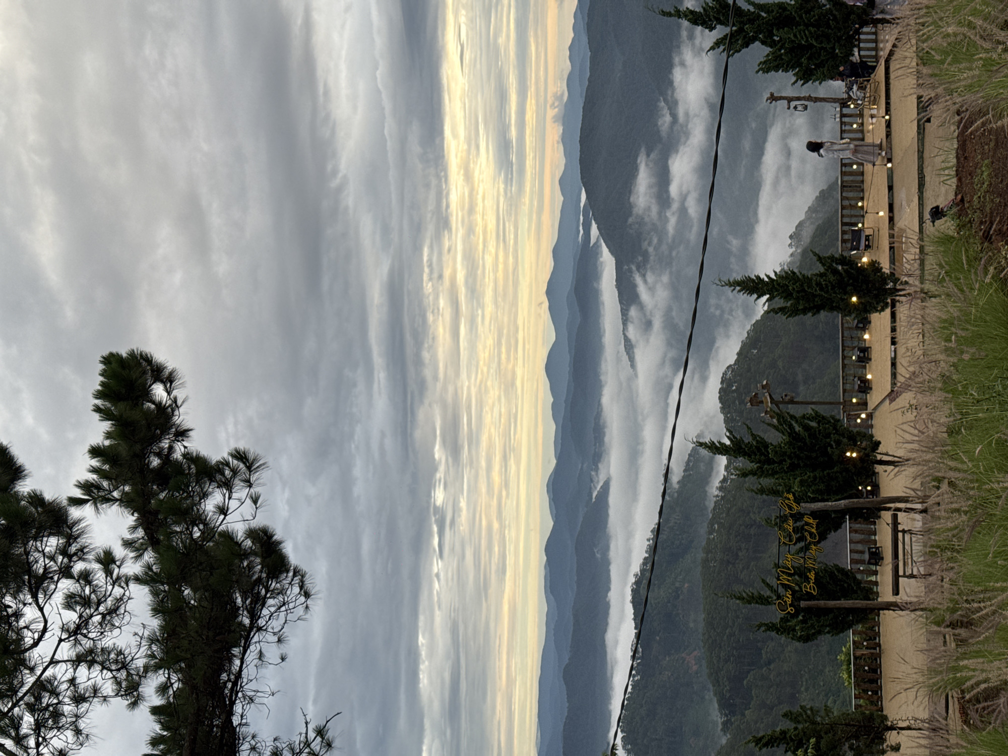 Evening mountain views with wind turbines captured in Phát Chi